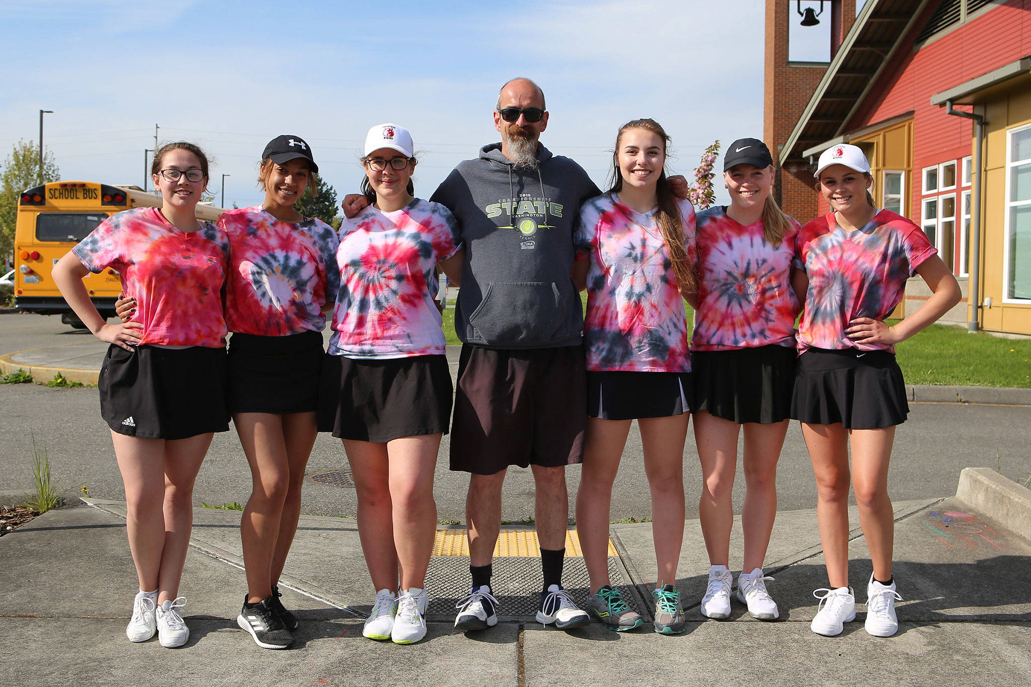 Coach Ken Stange stands with his six seniors who helped the Wolves win four Olympic League titles during their stay at Coupeville High School. From the left are Heather Nastali, Kameryn St. Onge, Claire Mietus, Maggie Crimmins, Sage Renninger and Payton Aparicio. (Photo by John Fisken)