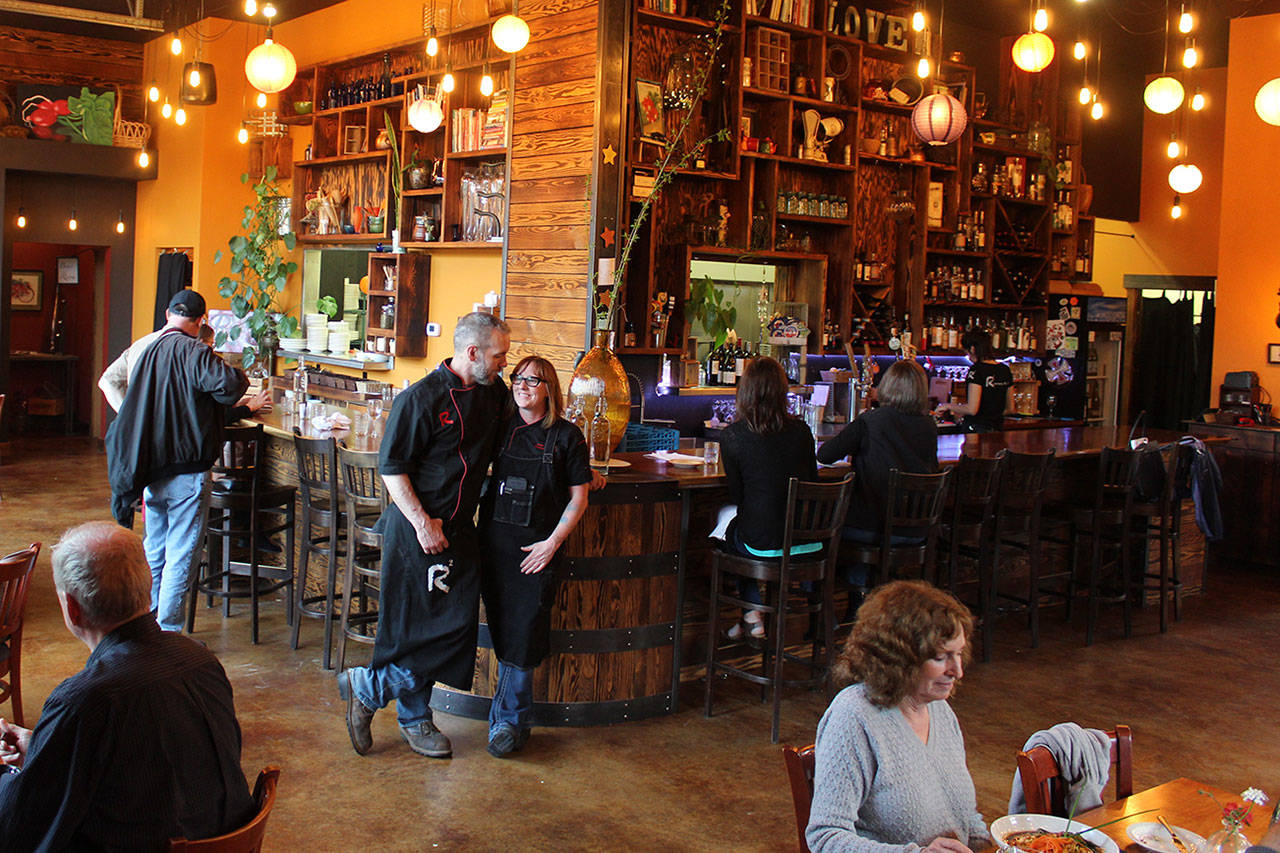 Roaming Radish, located in a renovated airplane hangar in the woods of Langley, is one of several Whidbey venues hosting a group of international food, wine and travel writers next week. Owners J.P. and Jess Downell (center) say the look forward to showing off Whidbeys locally-grown food.