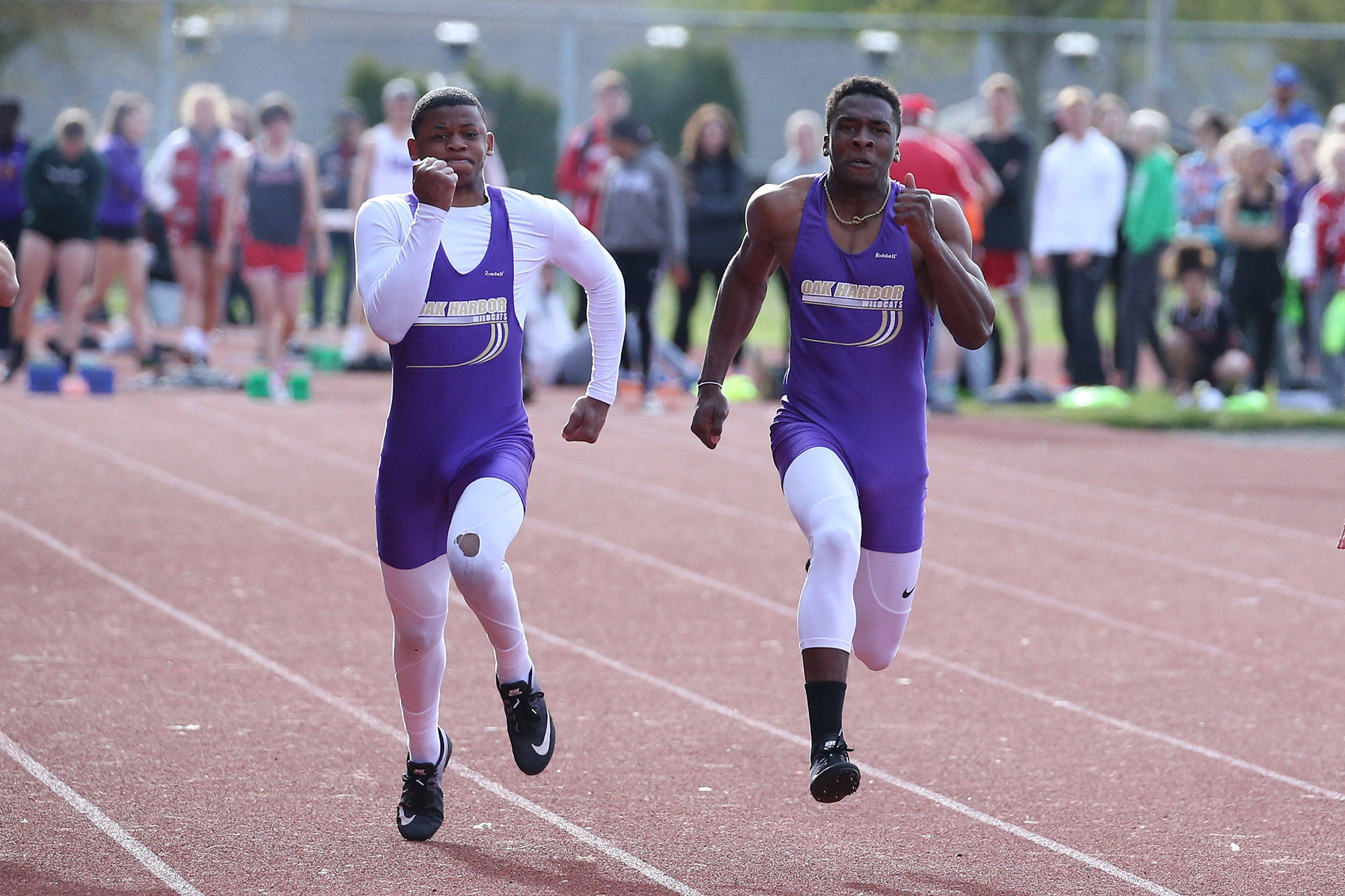 The Hardin brothers, Dorian, left, and Taeson, run the 100 meters at the Stanwood Twilight Invitational Friday.(Photo by John Fisken)