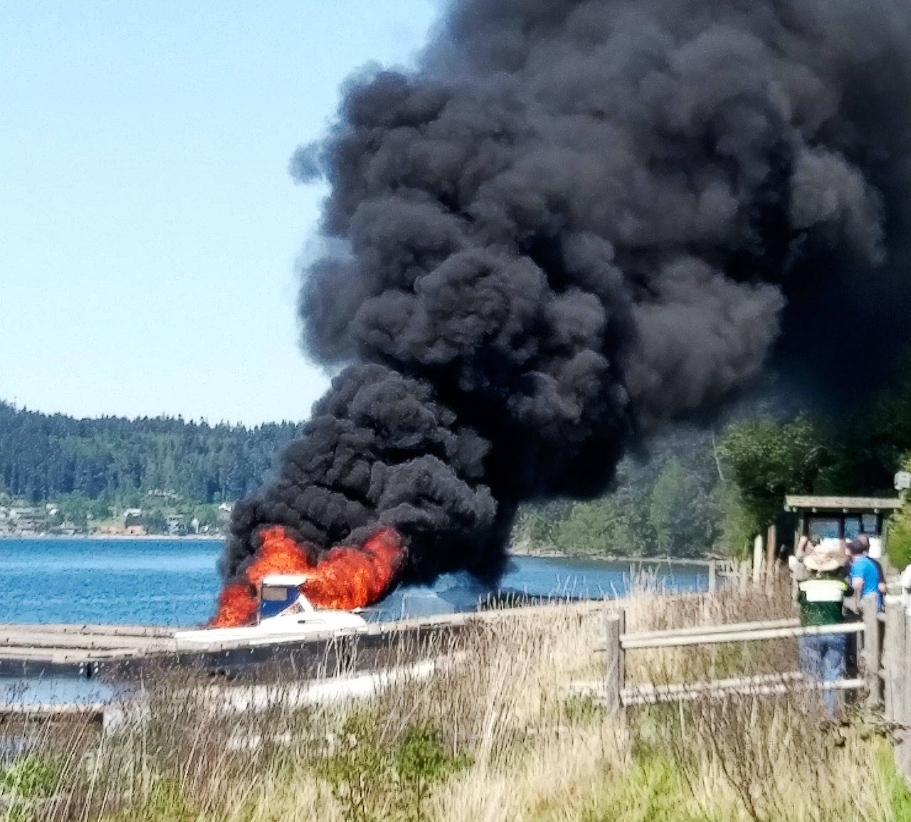 A small boat caught fire Saturday afternoon, which left it and two docks at Cornet Bay Marina destroyed. Photo provided