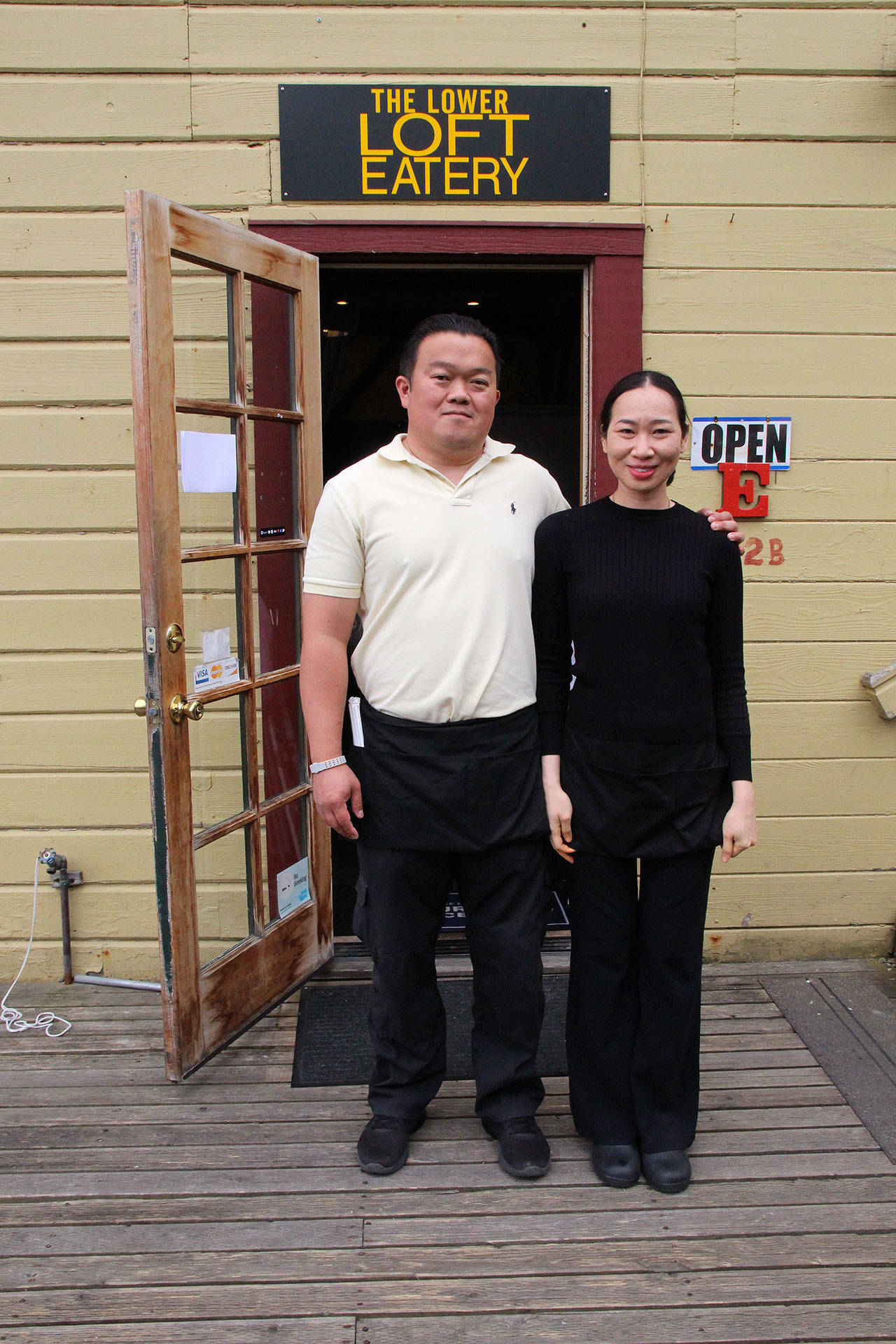 Photo by Maria Matson/ Whidbey News-Times                                &lt;em&gt;Chai and Dao Saipow stand&lt;/em&gt;&lt;em&gt; in front of the newly-renamed The Lo&lt;/em&gt;&lt;em&gt;wer Loft Eatery. &lt;/em&gt;