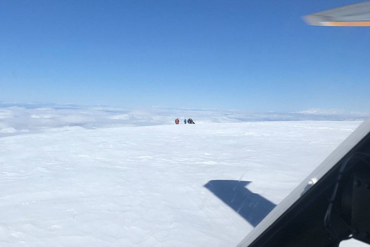 SAR crew members assist climbers stranded on Mount Baker during a rescue June 4, 2018.