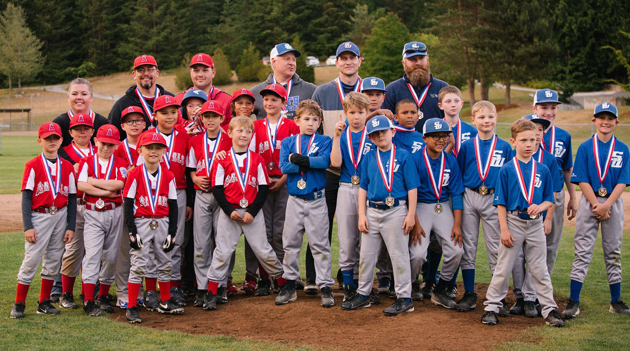 The North Whidey Angels and South Whidbey show off their medals after the championship game. (Submitted photo)