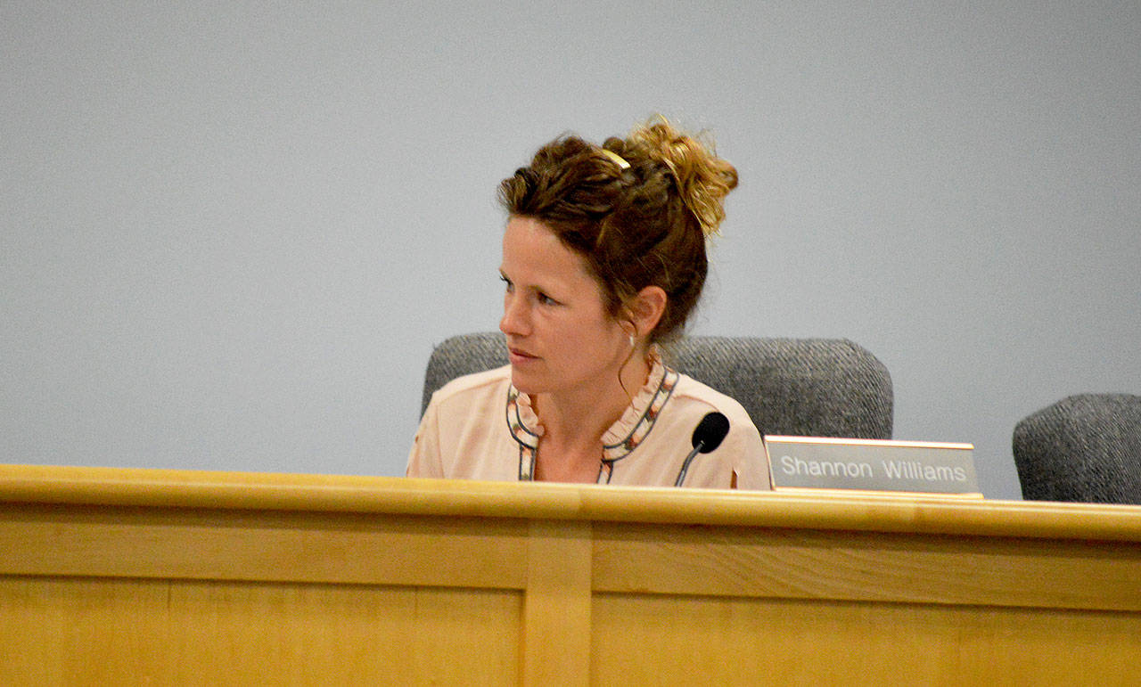 Planning Commission member Shannon Williams listens during a planning commission meeting Monday. At the meeting, she said “People who want to be here will work for it” during a discussion about the goals of the housing element of the comprehensive plan. The timeline of the almost-complete element shifted significantly because of her and other members’ concerns. Photo by Laura Guido/Whidbey News Group