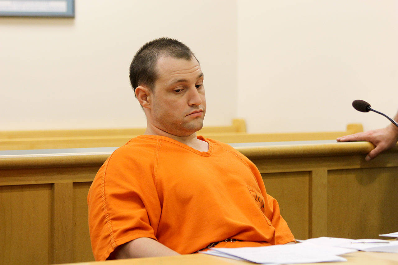 Photo by Jessie Stensland / Whidbey News Group.                                Convicted murderer Joshua Lambert appears bored during a hearing last Friday on a series of his motions. He is acting as his own attorney.