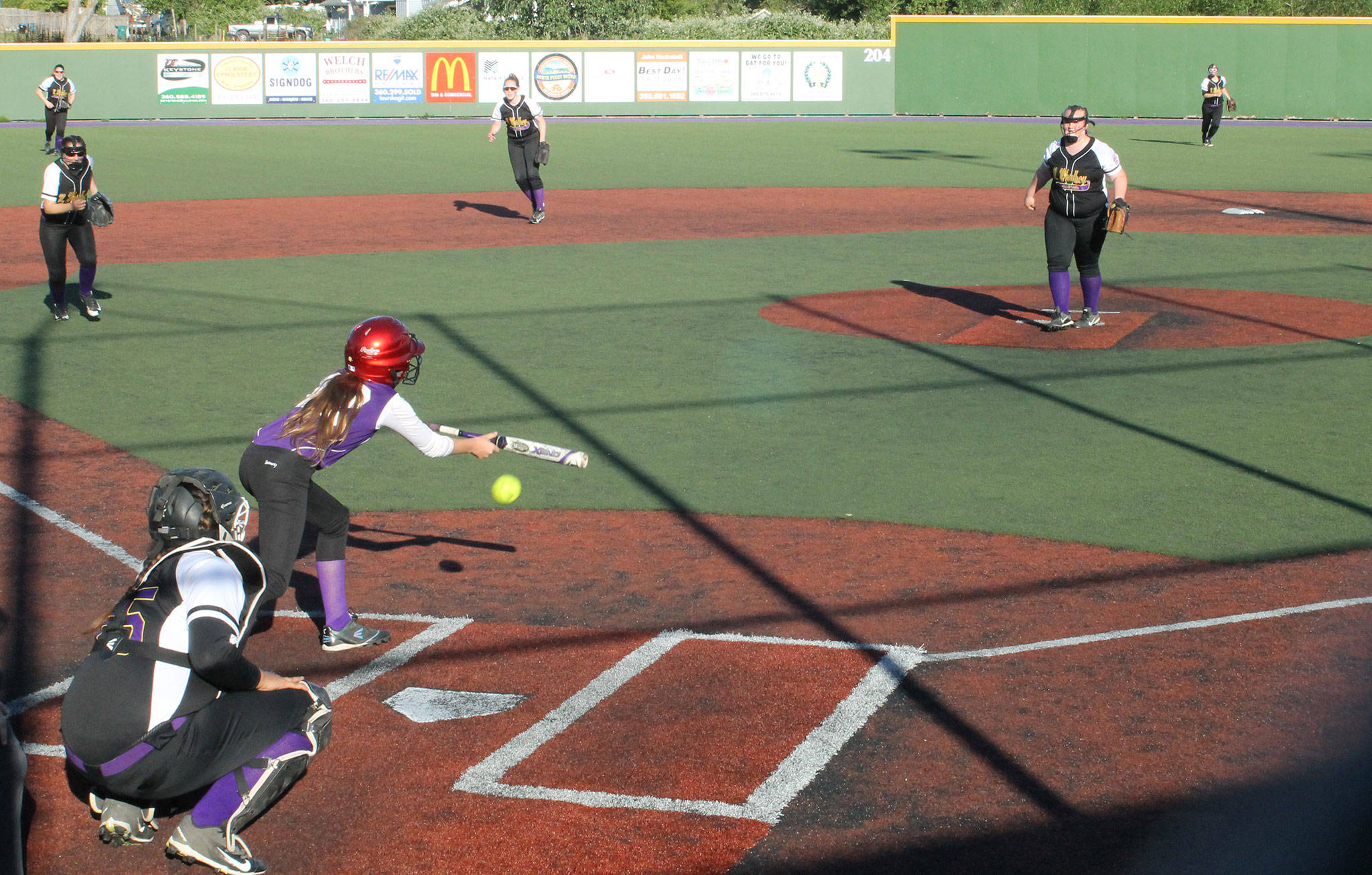 North Whidbey pitcher Lexi Phillips throws a strike by an Anacortes batter attempting to bunt. (Photo by Jim Waller/Whidbey News-Times)