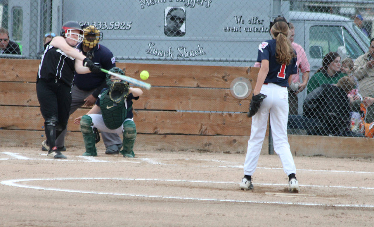 Allie Lucero doubles to ignite an eight-run third inning.(Photo by Jim Waller/Whidbey News-Times)                                Allie Lucero rips a double for Central Whidbey. (Photo by Jim Waller/Whidbey News-Times)