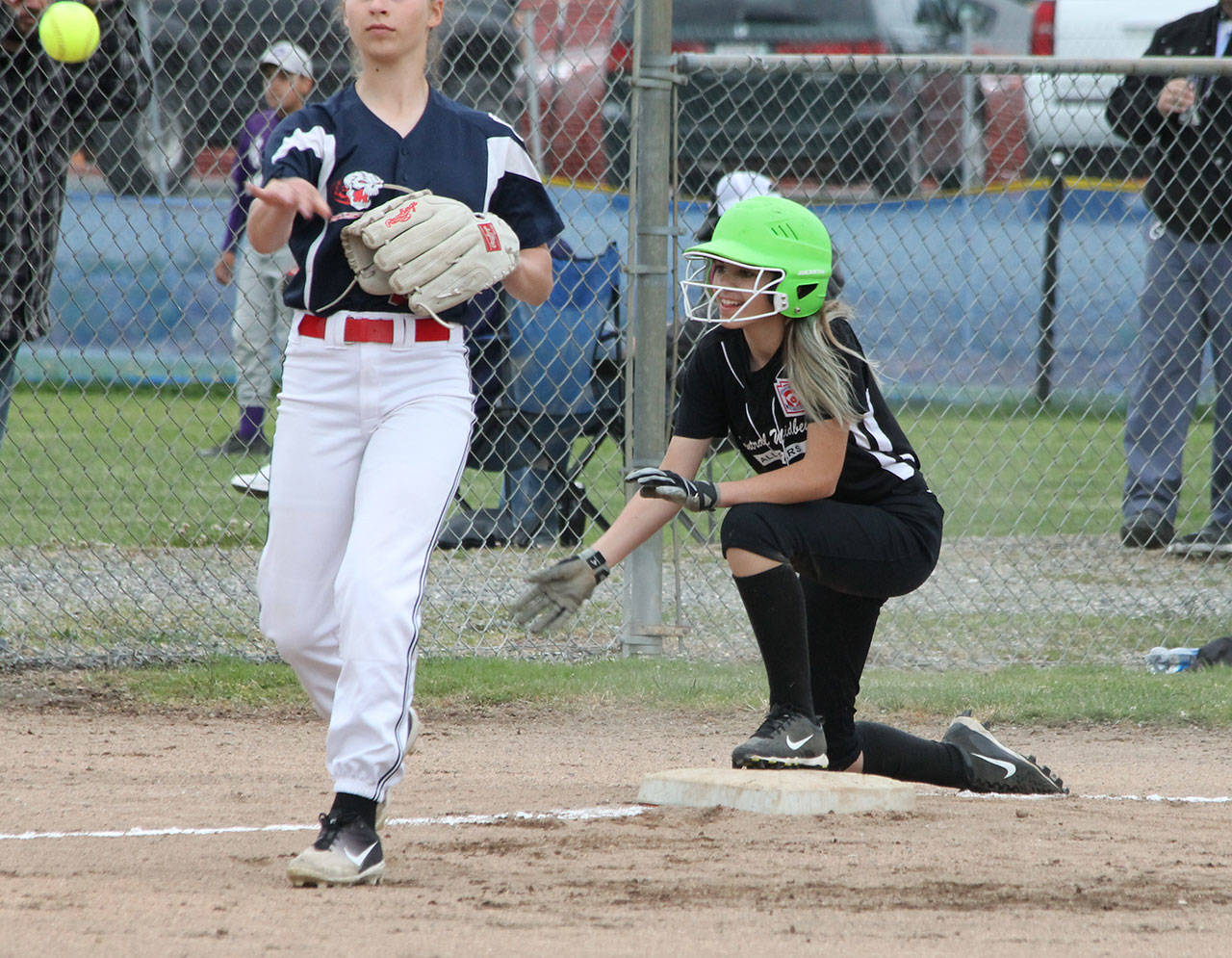 Vivian Farris safely reaches third base.(Photo by Jim Waller/Whidbey News-Times)