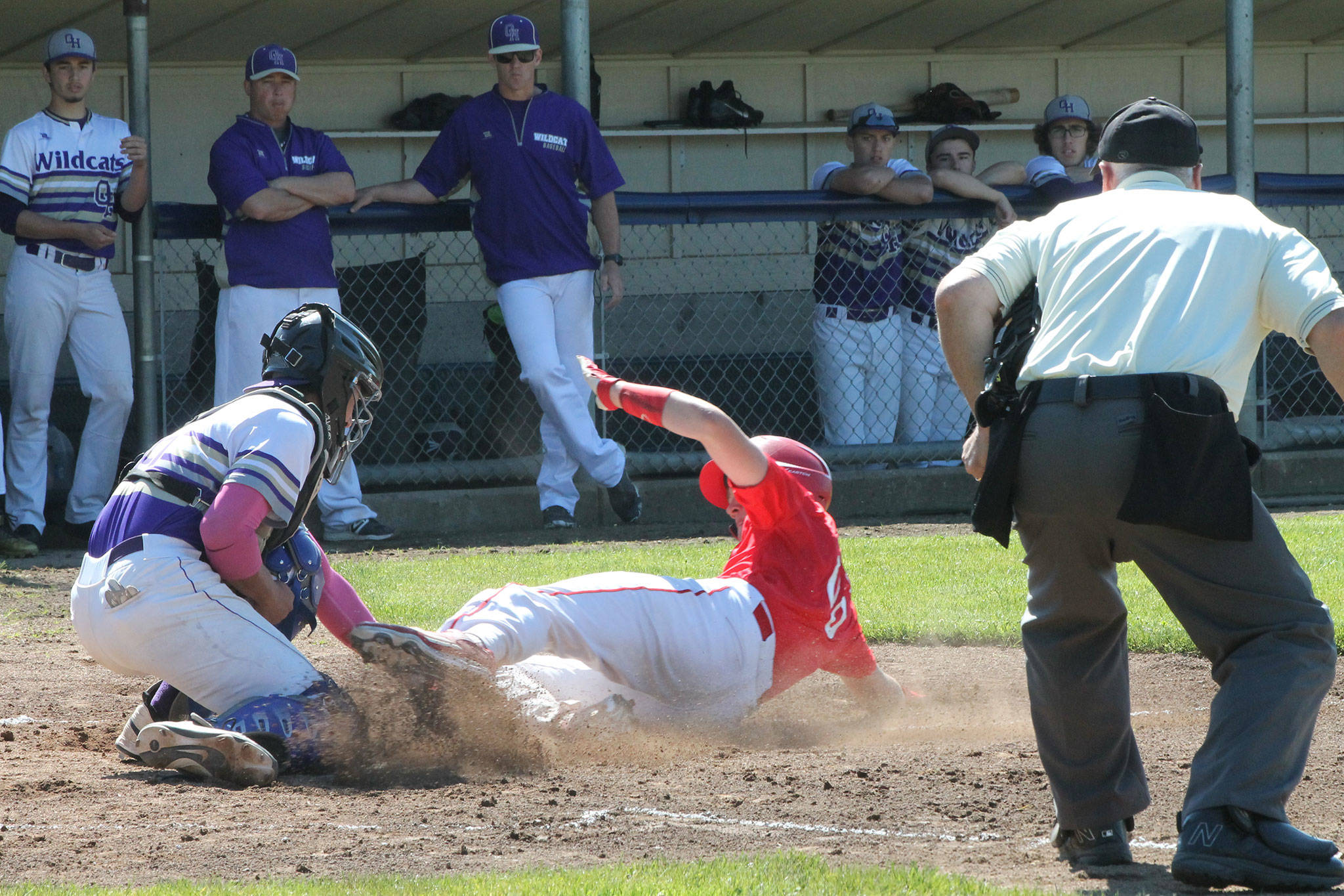 Oak Harbor catcher Aaron Martinez puts the tag on Coupeville’s Gavin Knoblich in Saturday’s tournament game in Anacortes. (Photo by Jim Waller/Whidbey News-Times)