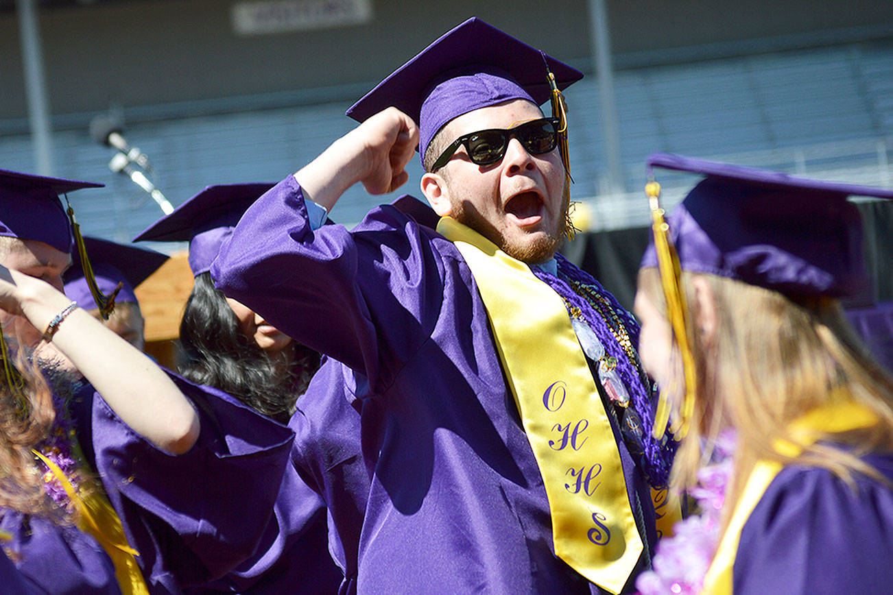 Photo by Laura Guido/Whidbey News-Times.                                Donovan McCulley cheers at the end of the commencement ceremony Saturday.