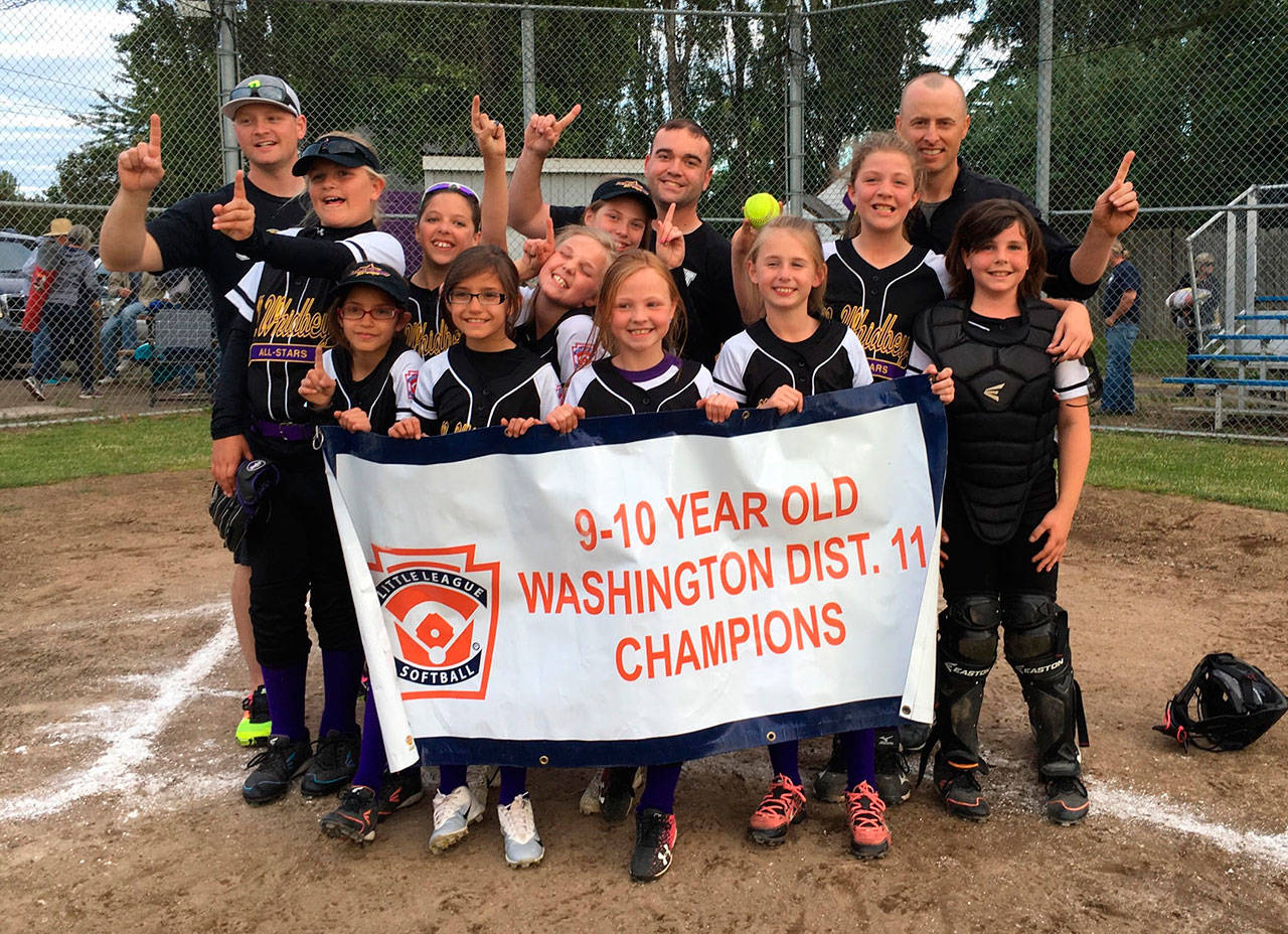 The North Whidbey 9-10 softball team shows off its district championship banner. (Submitted photo)