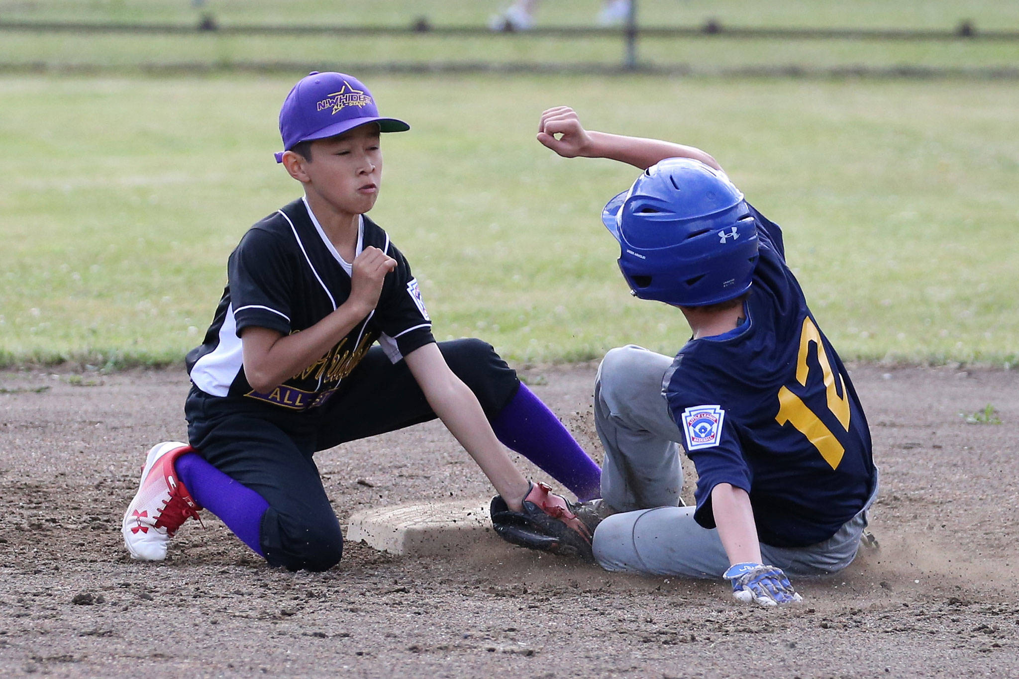 North Whidbey shortstop Holden Jesus puts the tag on a Burlington-Edison runner in Monday’s game.(Photo by John Fisken)