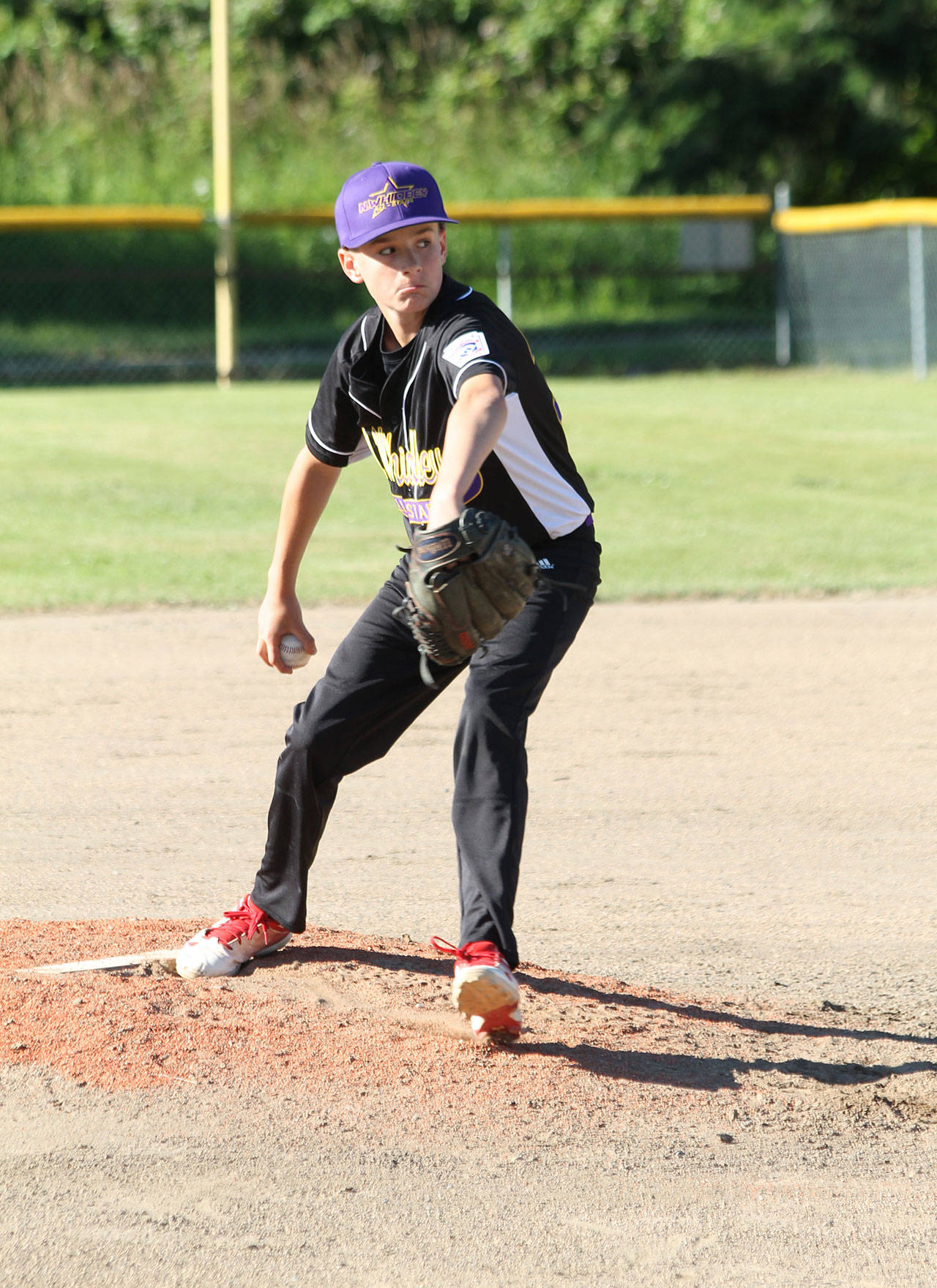 North Whidbey’s Jacob Figarelle eyes the strike zone in his one-hitter Tuesday.(Photo by Jim Waller/Whidbey News-Times)