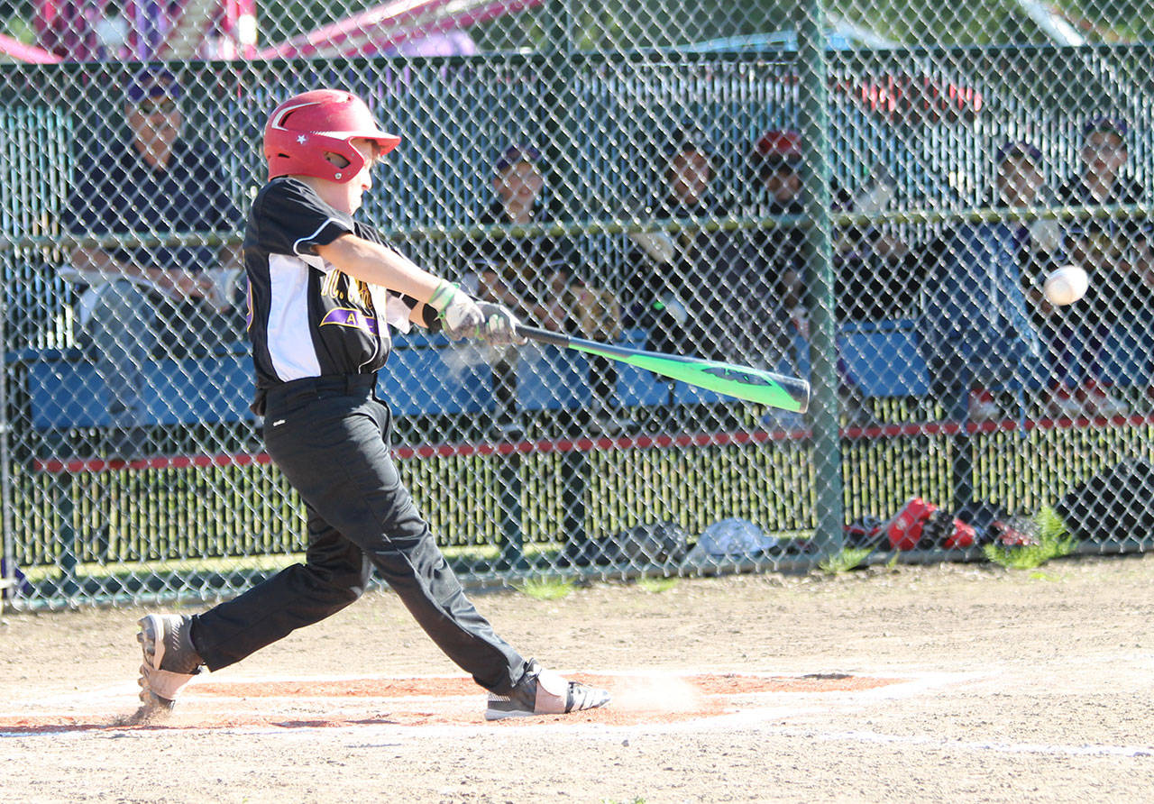 Christian Gisvold laces a triple to lead off the bottom of the first inning.(Photo by Jim Waller/Whidbey News-Times)