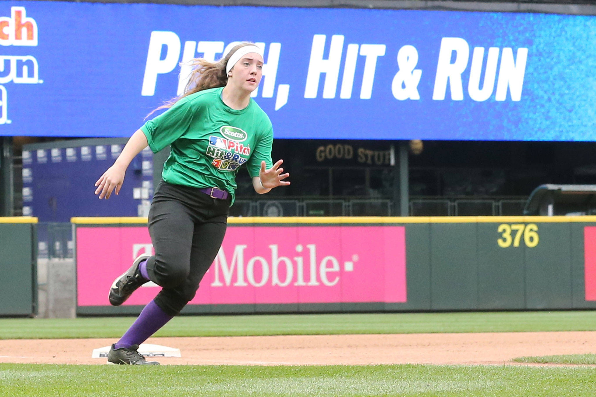 Katie Bishop races around third base during the Pitch, Hit and Run contest Sunday. (Photo by John Fisken)