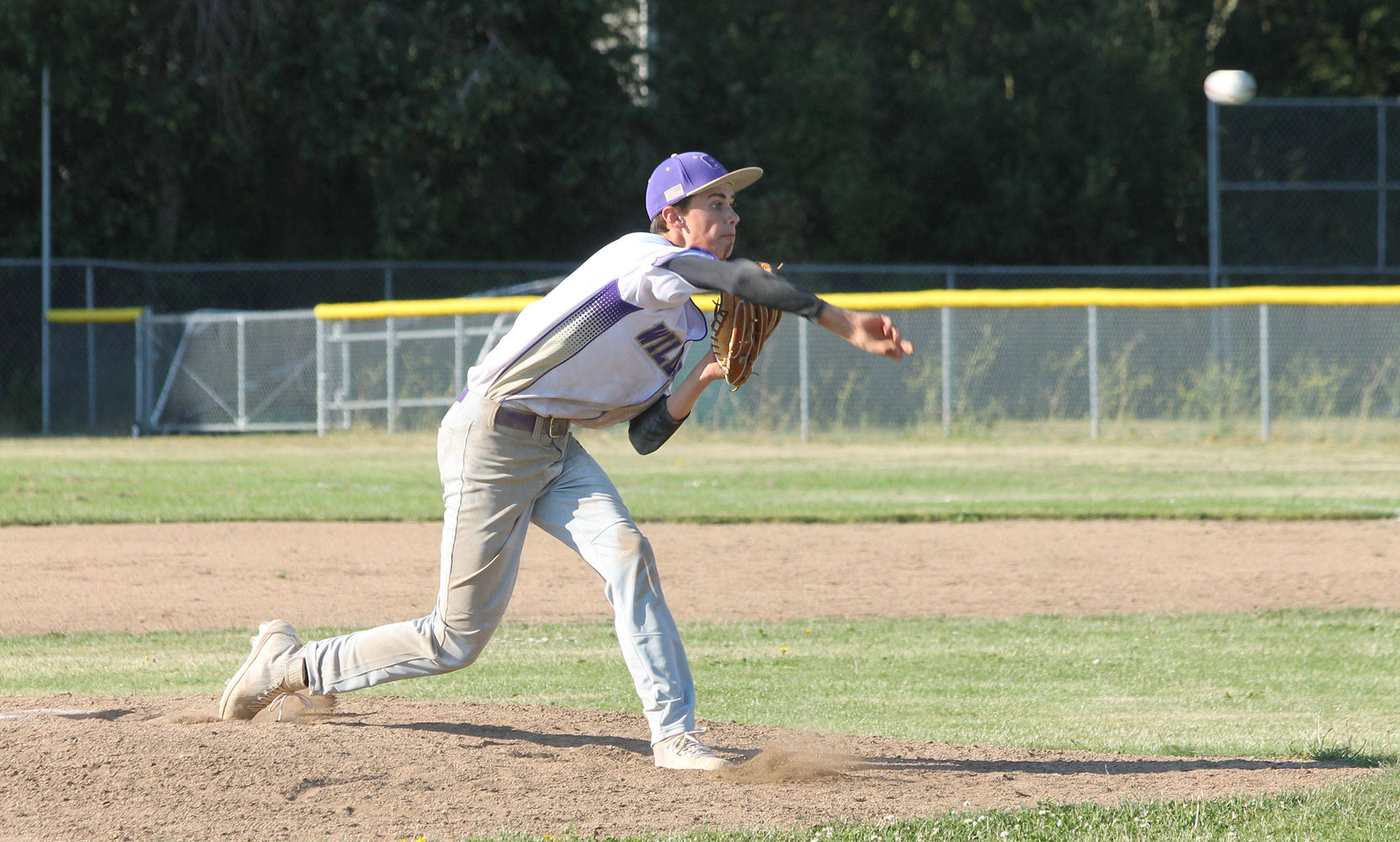 Gage McLeod fires a pitch in the Babe Ruth team’s final game last month. (Photo by Jim Waller/Whidbey News-Times)