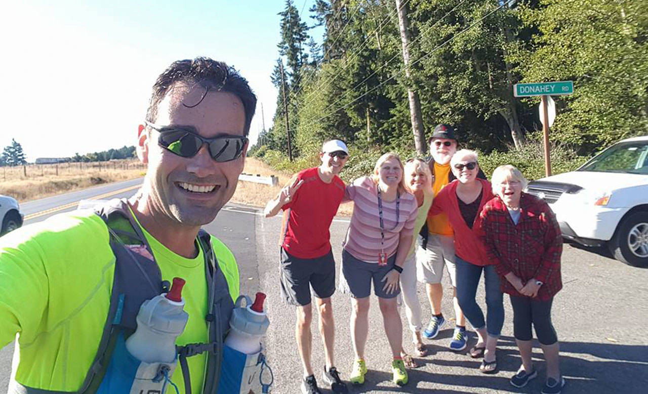 James Steller, left, and fellow runner Andy Wyman are joined by well-wishers Christy Messner, Aimee Bishop, Paul Messner, Barbi Ford and Marilyn Messner on the first day last year’s run. (Submitted photo)