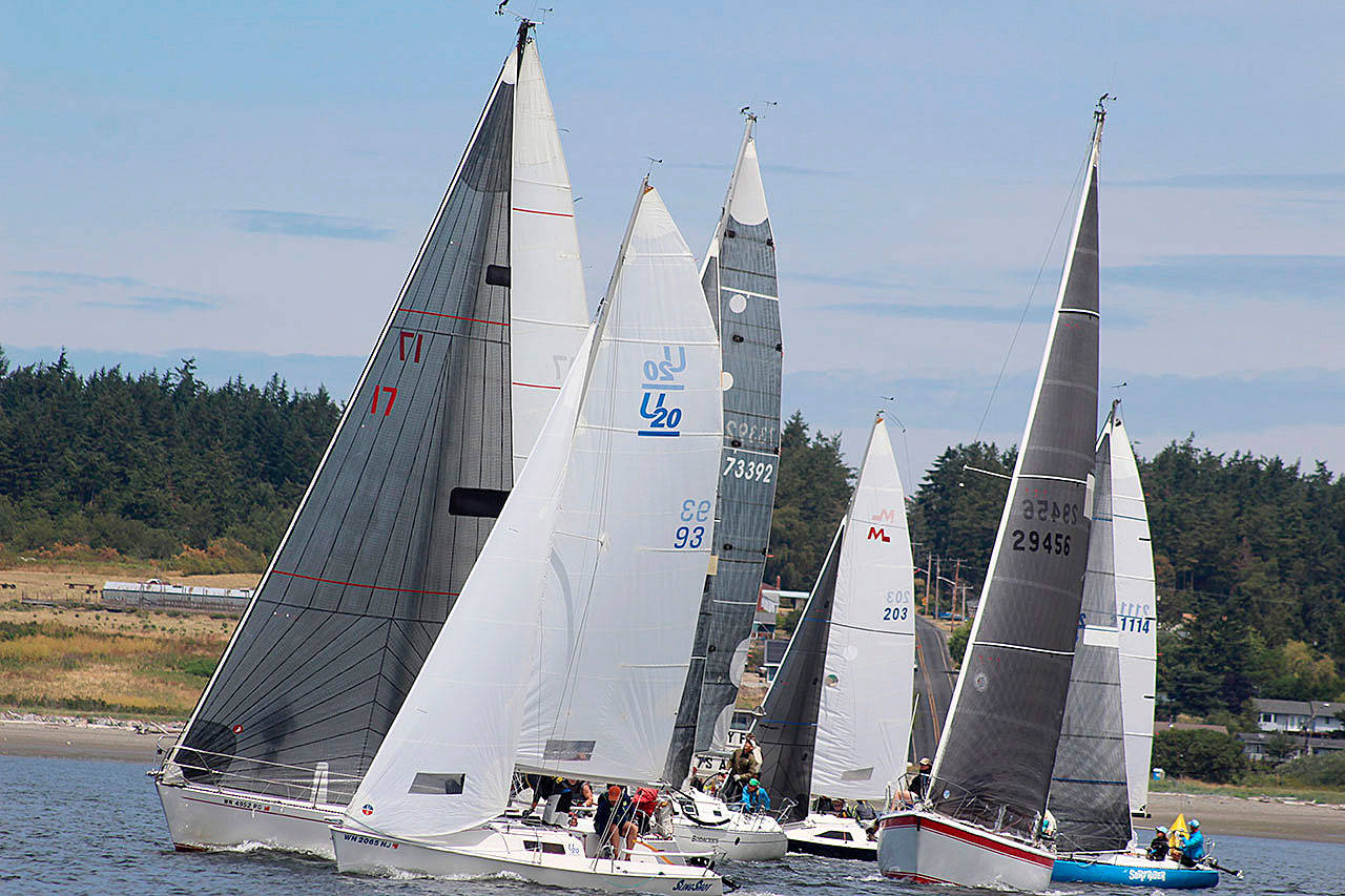 Boats and their crews prepare for a heat in last year’s Whidbey Island Race Week. Racing this summer begins at noon Thursday, July 19. (File photo)