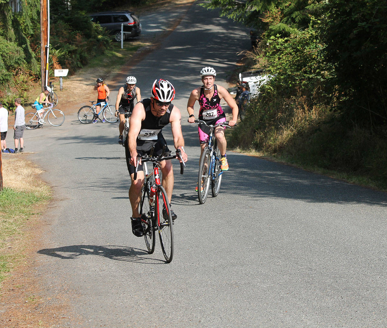 Overall winner Seth Grisham begins the bike portion of the triathlon Saturday.(Photo by Jim Waller/Whidbey News-Times)