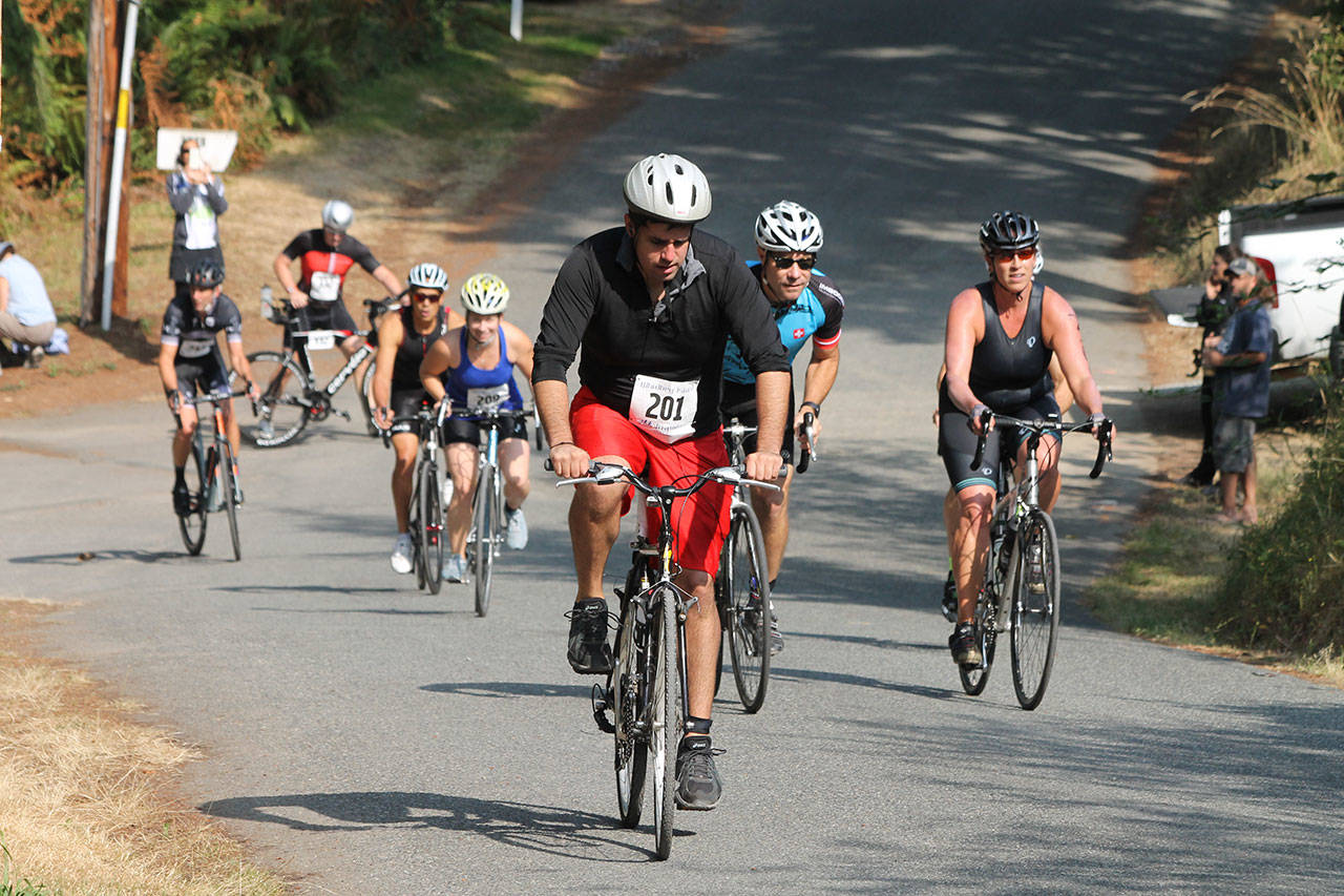 Competitors start the bike ride heading up hill in Saturday’s Whidbey Island Triathlon. (Photos by Jim Waller/Whidbey News Group)