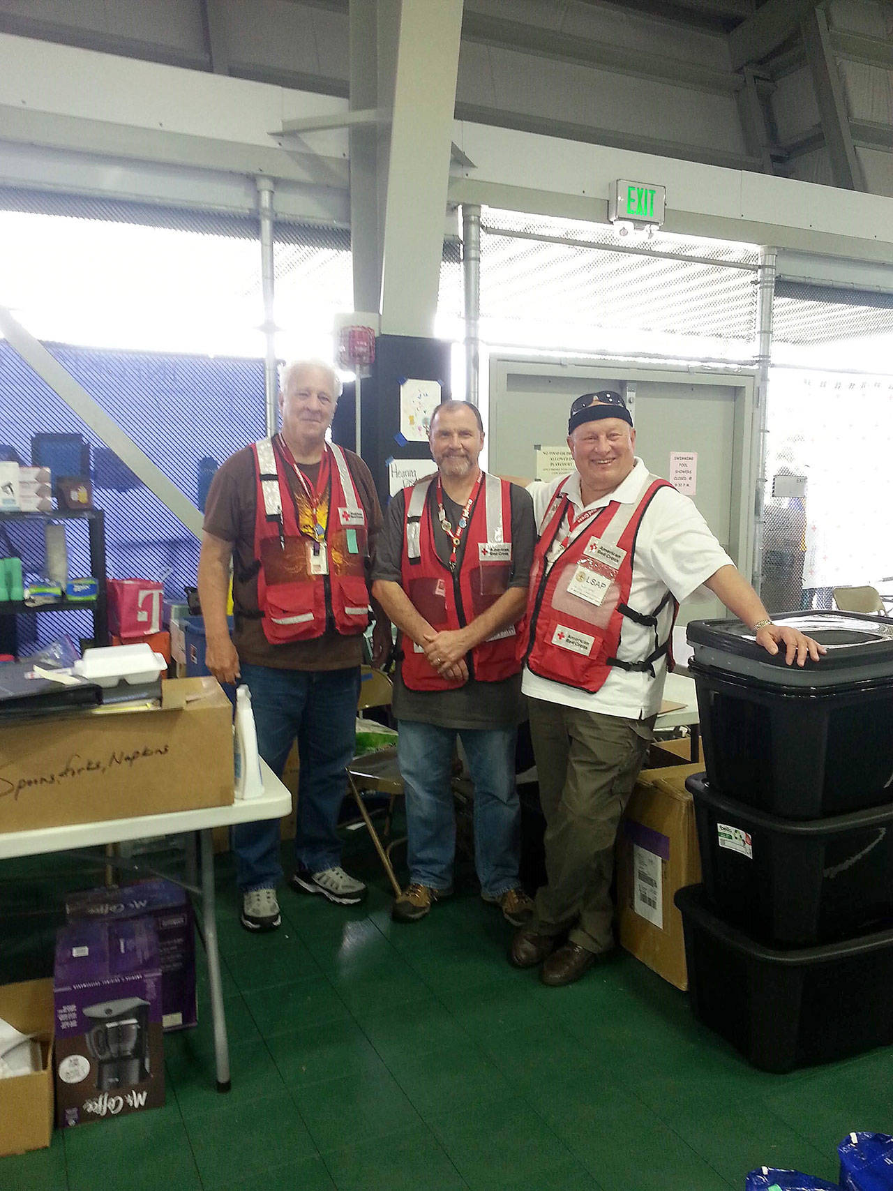 Photo provided by Ron Conlin                                From left, Life Safety and Asset Protection senior volunteer Jerry Hall, shelter sites director Rod Winters of Freeland and LSAP manager Ron Conlin of South Whidbey in the Pahoa gym.