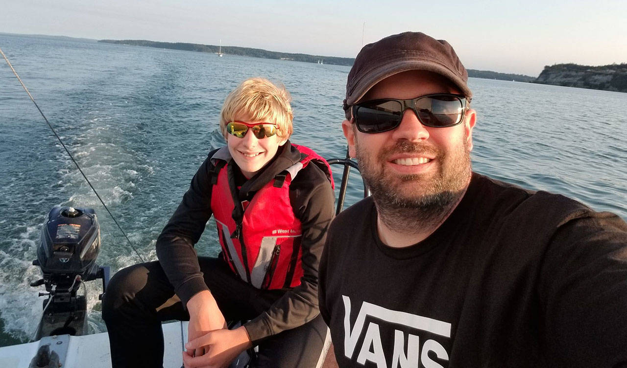 Crewman Ryan Nowicki, right, takes a selfie with Vertigo skipper Thomas Buys.