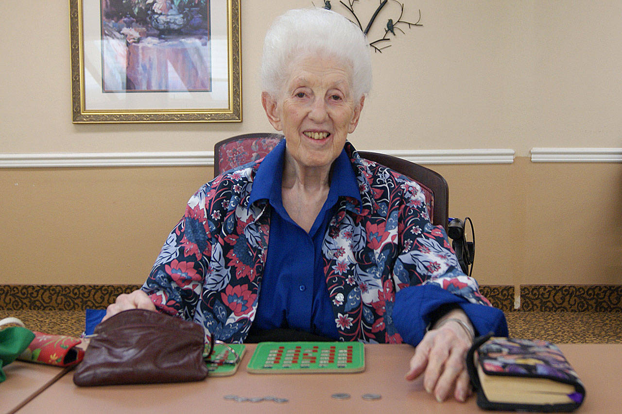 Photo by Maria Matson / Whidbey News Group                                Peggie Suess will be celebrating her 100th birthday on Aug. 22. She sits here at Summer Hill Senior Living, ready for the day’s Bingo game.