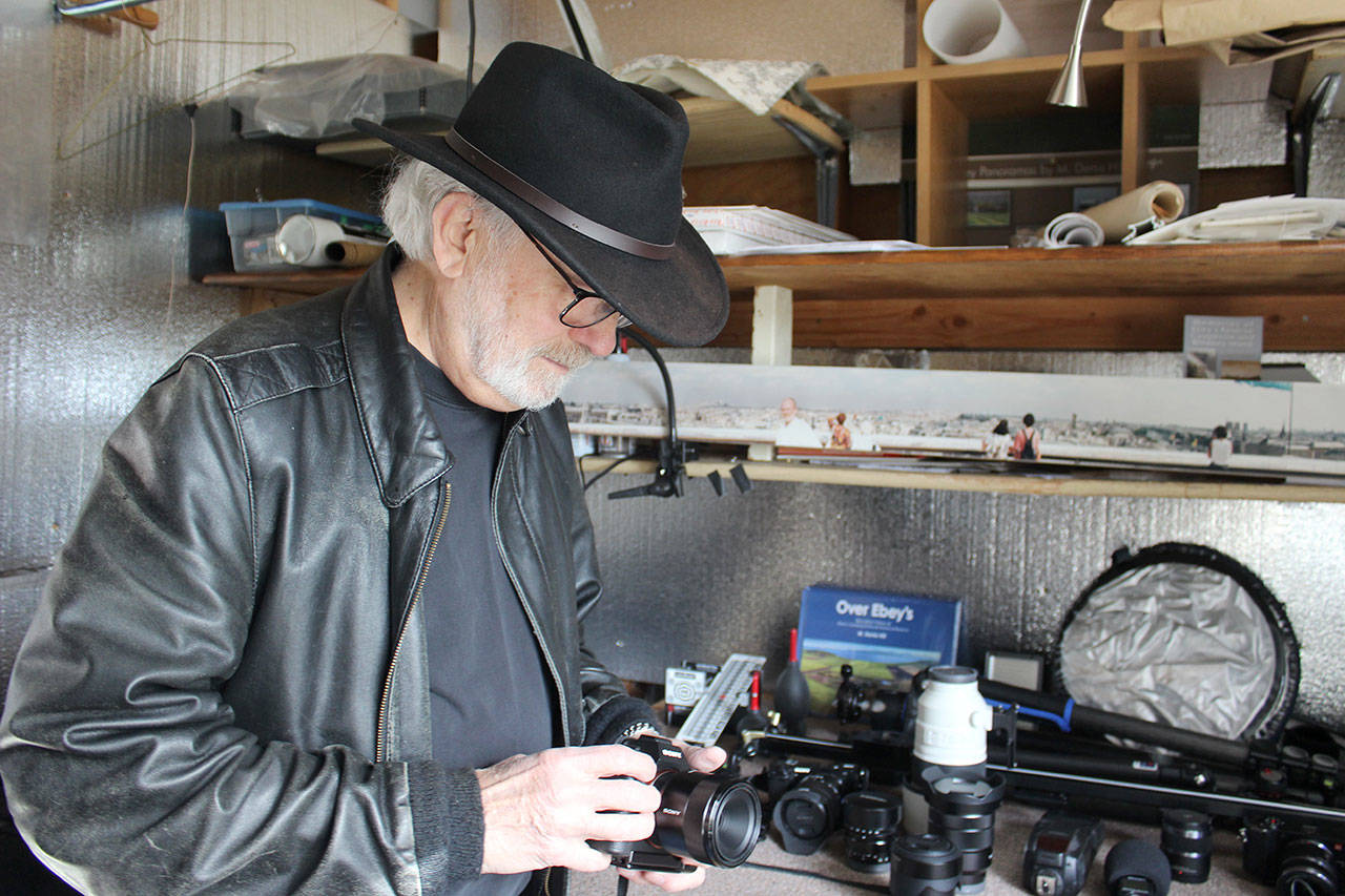 Coupeville photographer Denis Hill, known for his panoramic images of Ebeys National Reserve, is also part of the 15th Annual Artists Summer pen Studio Tour (Photo by Patricia Guthrie/Whidbey News Group)<address> </address>