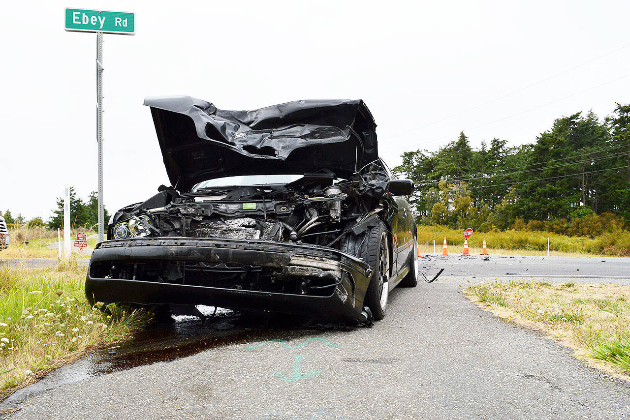 A driver in a black bmw struck another vehicle Thursday morning on State Route 20 near Ebey Road. Photo by Laura Guido/Whidbey News-Times