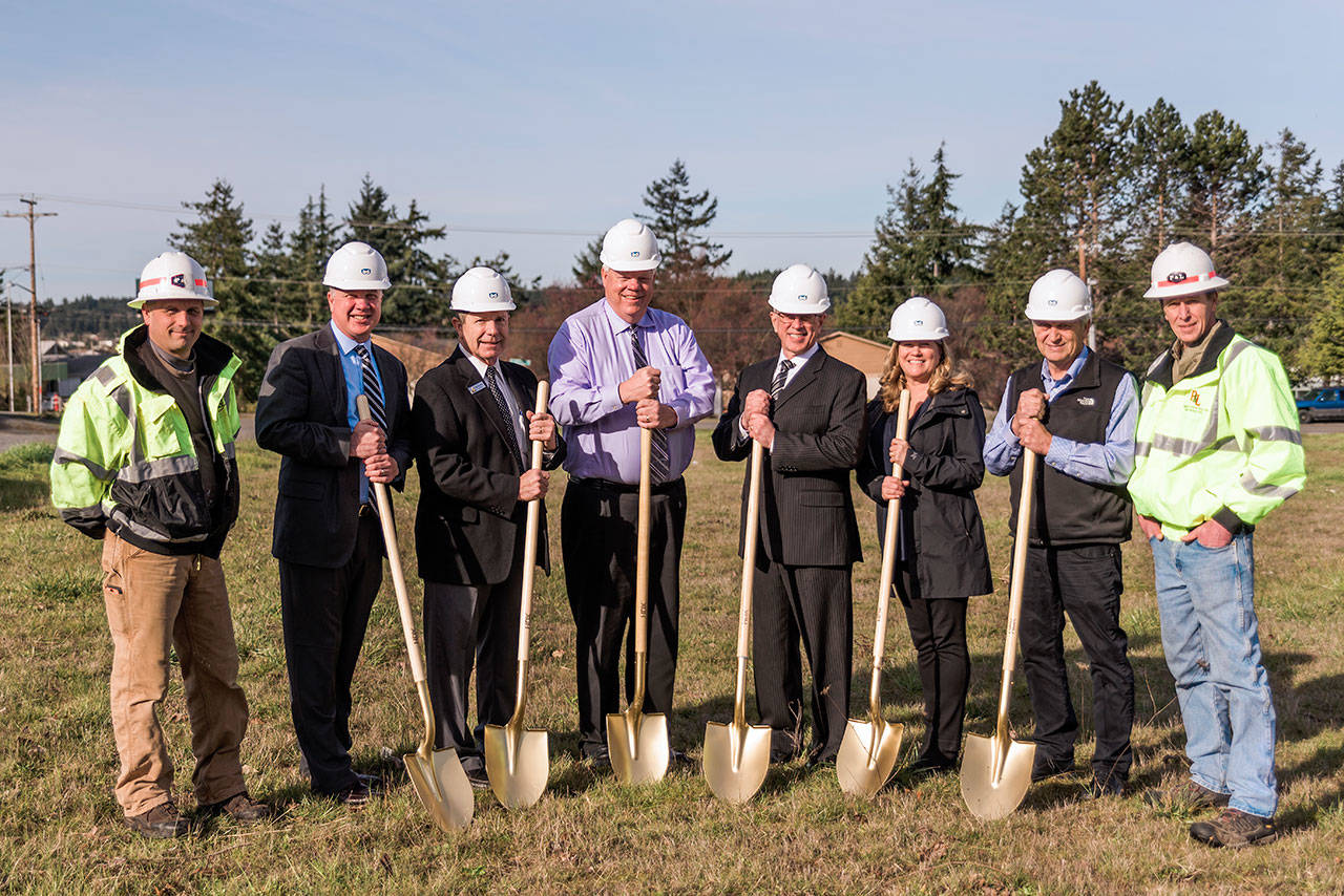 Photo provided                                Breaking ground for a new SaviBank in Oak Harbor are, from left to right: Brian Swanson, project superintendent, P & L General Contractors; Todd Krantz, vice president of SaviBank and Oak Harbor branch manager; Oak Harbor Mayor Bob Severns; Andy Hunter, president of SaviBank; Mike Cann, chairman and CEO of SaviBank; Kari Holmly, SVP/chief retail banking officer; Ron Wallin, president and chairman, P & L General Contractors, and; Gary Lampers, project manager, P & L General Contractors