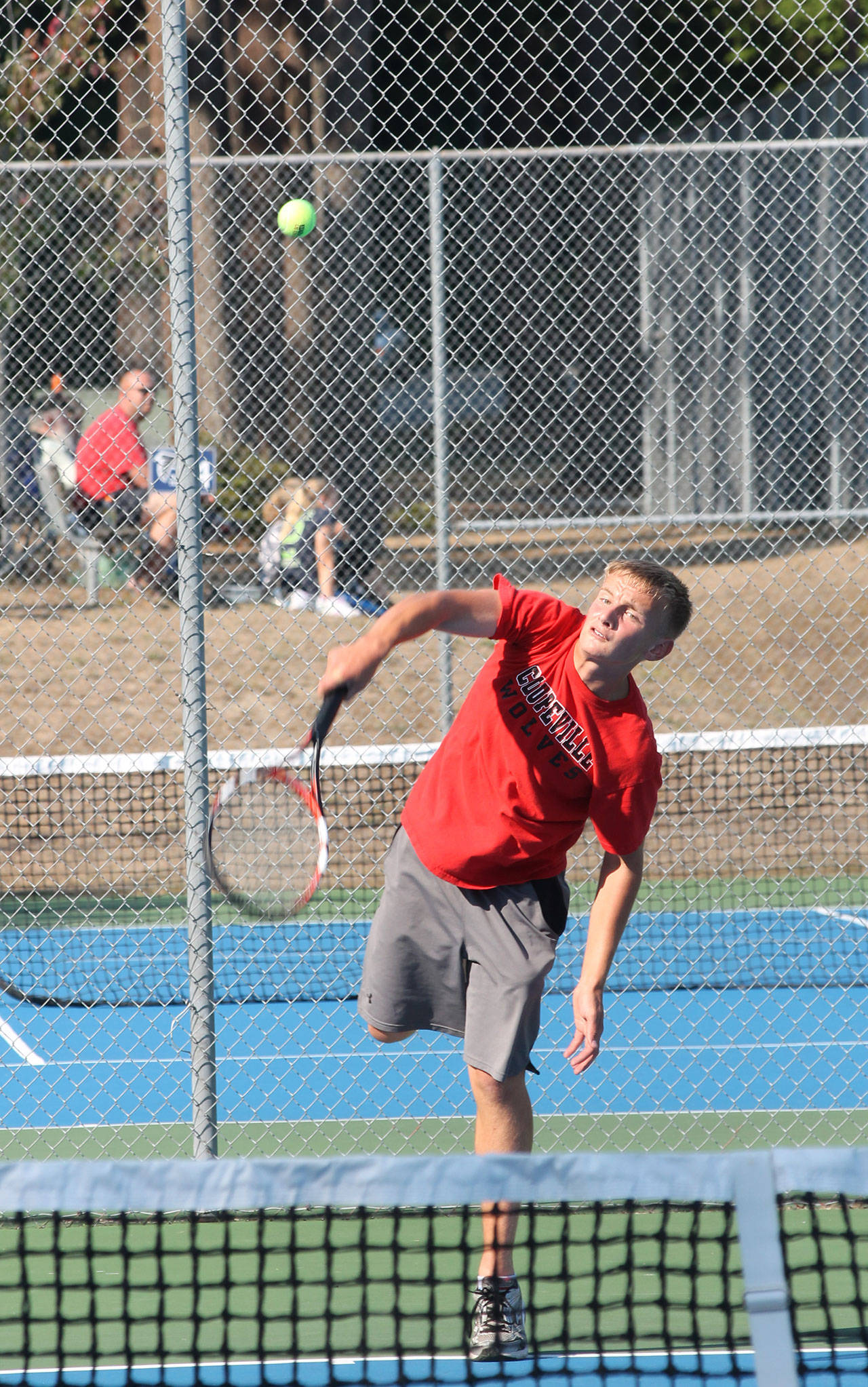 Drake Borden fires a serve in his win in second singles. (Photo by Jim Waller/Whidbey News-Times)