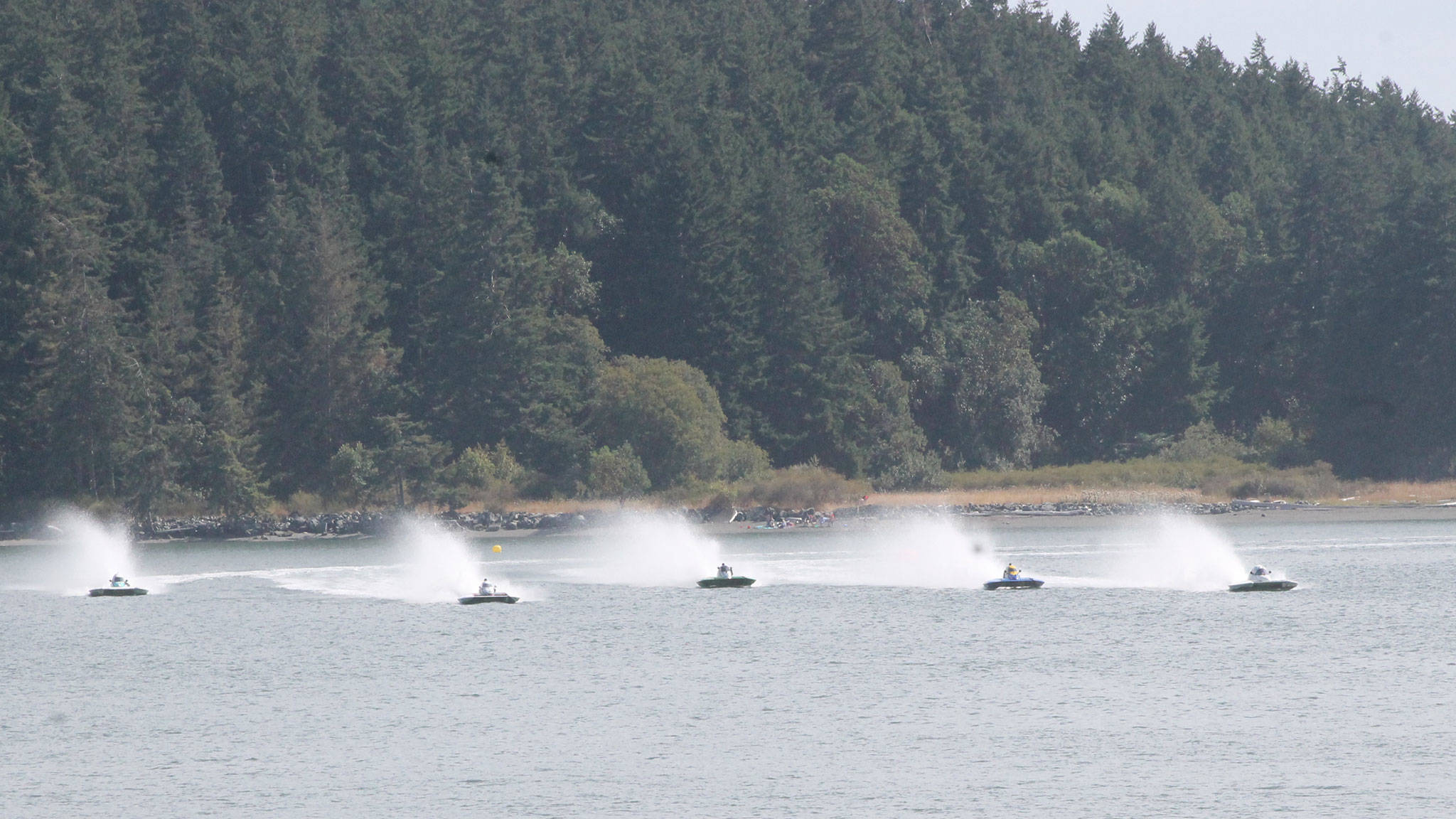 Boats shoot across the starting line in last year’s race. (Photo by Jim Waller/Whidbey News-Times)