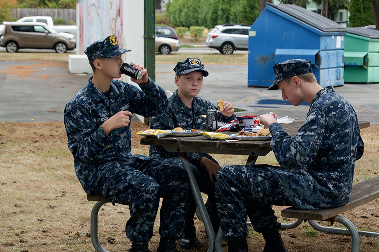 Naval Air Station Whidbey Island Sea Cadets Jackson Oliverson, David Stasel and Andrew Taylor enjoy food served at Saturday’s Military Appreciation Picnic.