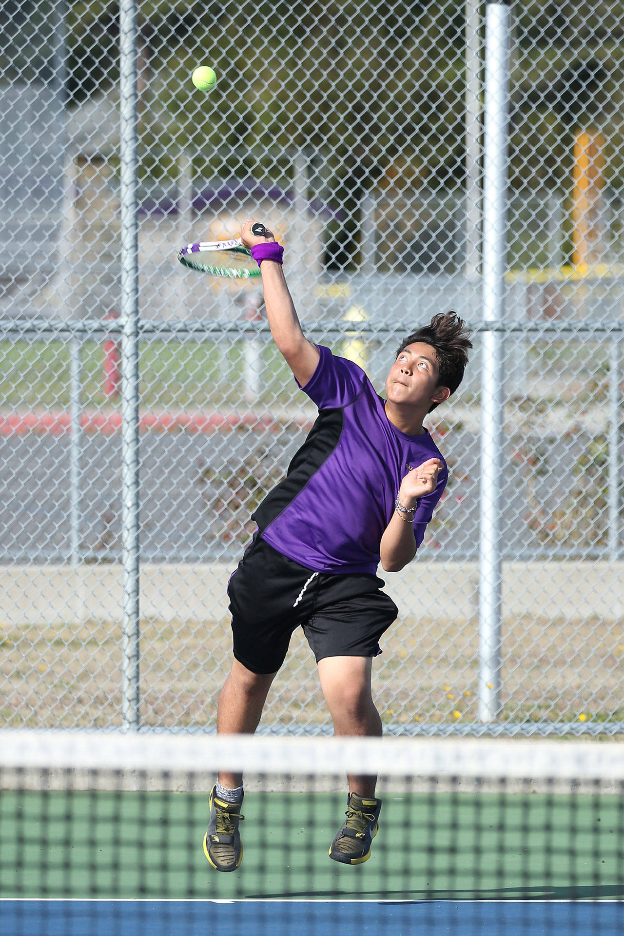 Elsian Atienza serves in Wednesday’s match with M-P. (Photo by John Fisken)