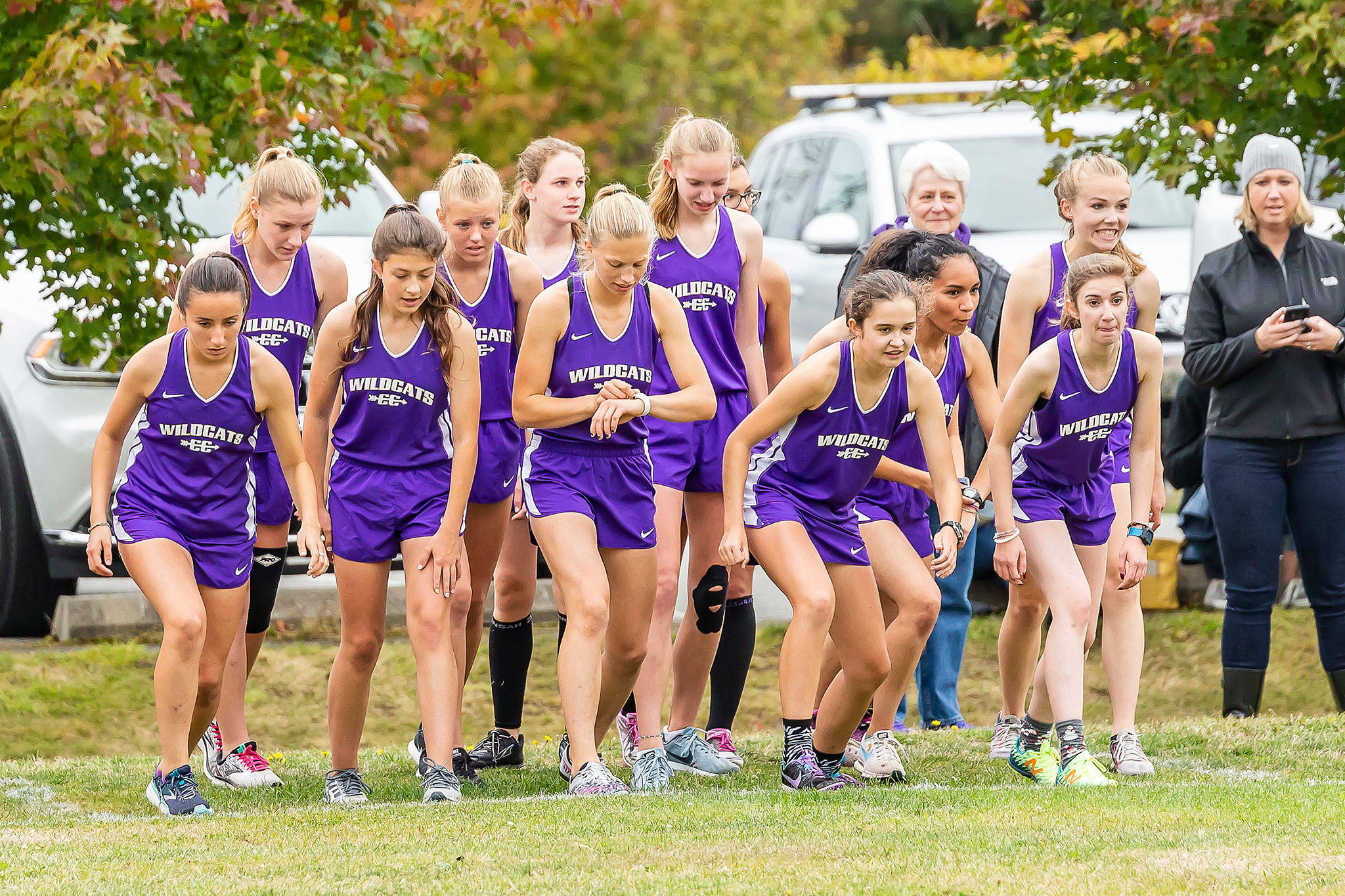 The Wildcats girls get ready to hit the course.(Photo by John Fisken)