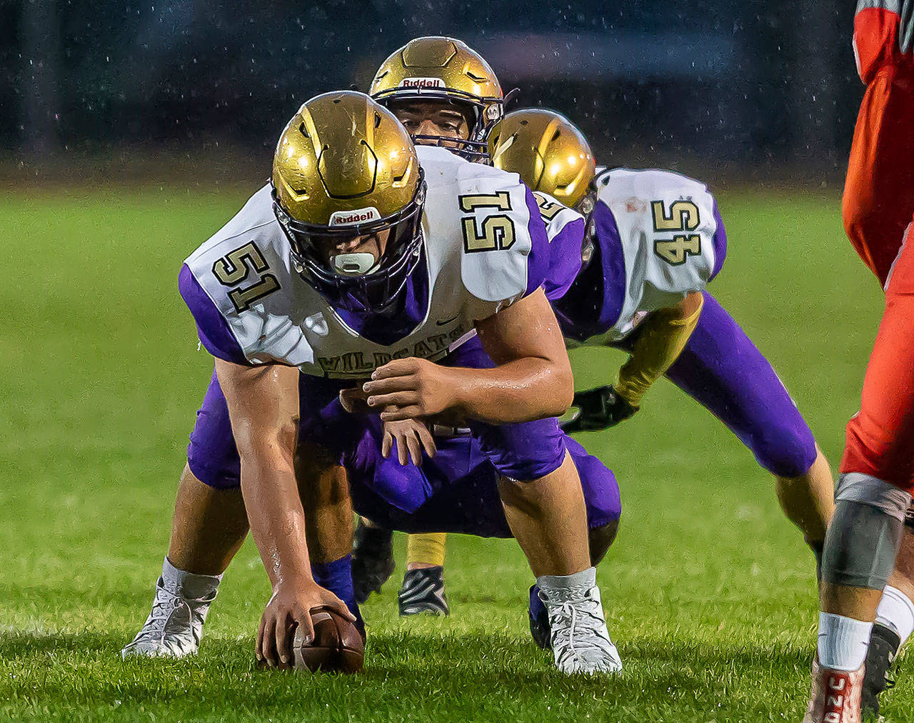 Nathaneil Nunez prepares to hike to Caleb Fitzgerald as Caden Leckelt waits in the Wildcat backfield.(Photo by John Fisken)