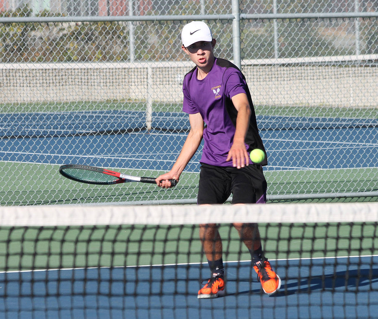 Nick Krantz returns a shot in his win in first singles. (Photo by Jim Waller/Whidbey News-Times)