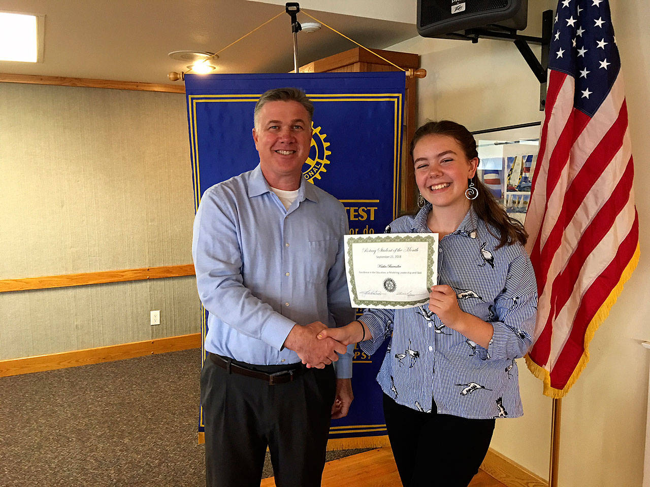 Photo provided                                Kaitlin Barrailler of Oak Harbor High School and President Todd Krantz with certificate.
