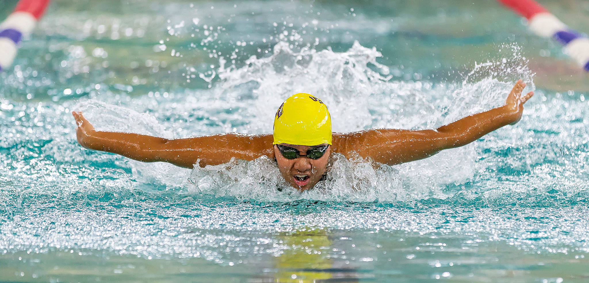 Grace Chargualaf competes in the butterfly at a double-dual meet in Snohomish Tuesday. (Photo by John Fisken)