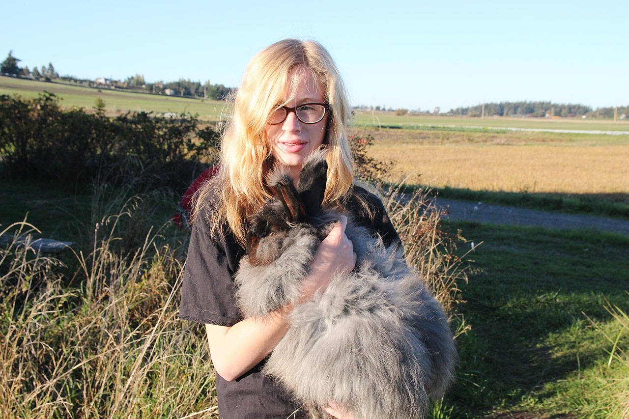 Photo by Laura Guido/Whidbey News-Times                                Wynter Arndt, 12, holds Sokka, one of the “vampire” rabbits featured in the Haunted Petting Zoo.