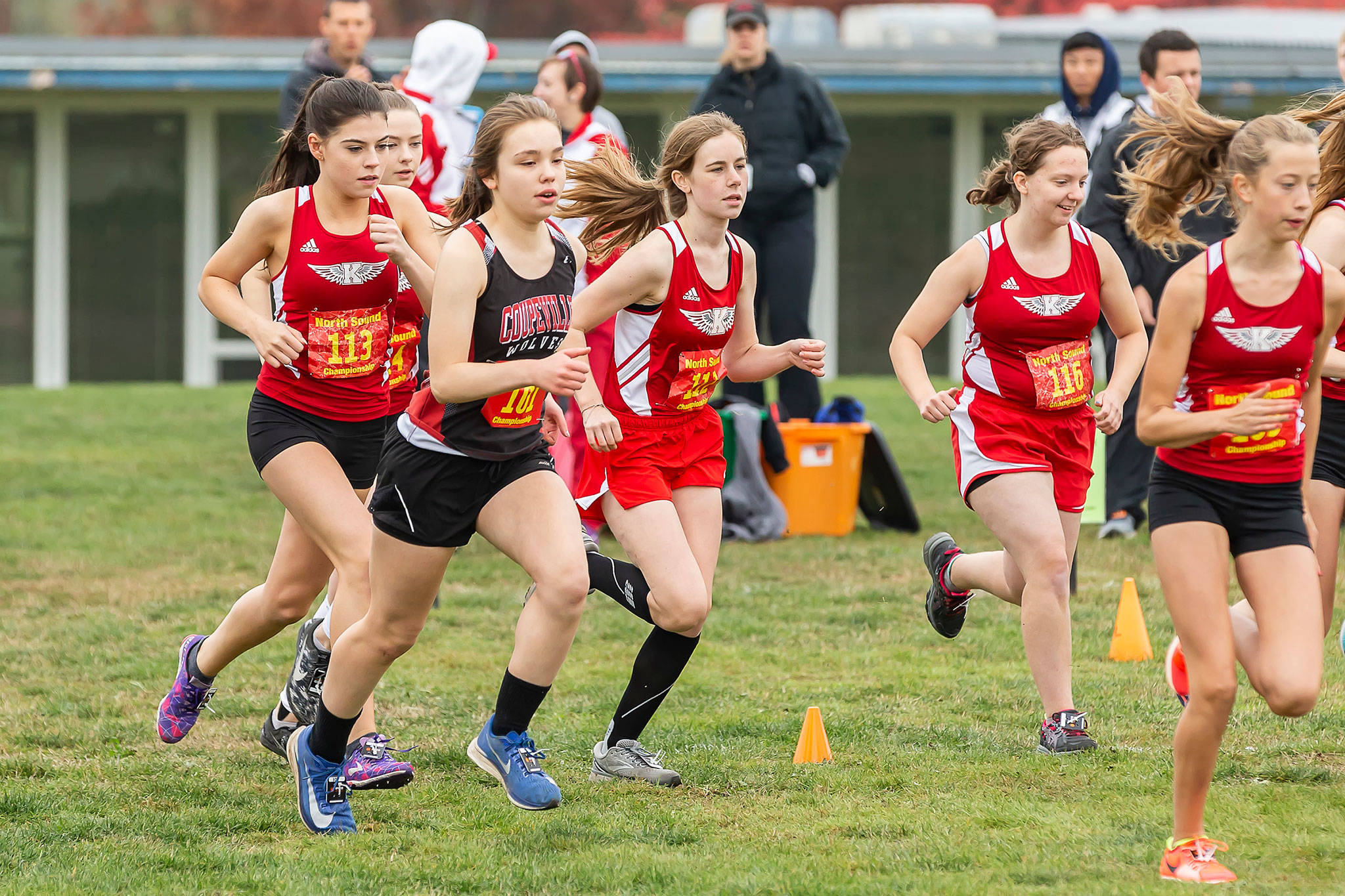 Coupeville’s Alana Mihill (black jersey) runs with a group of King’s girls in Saturday’s North Sound Conference Championships Saturday.(Photo by John Fisken)