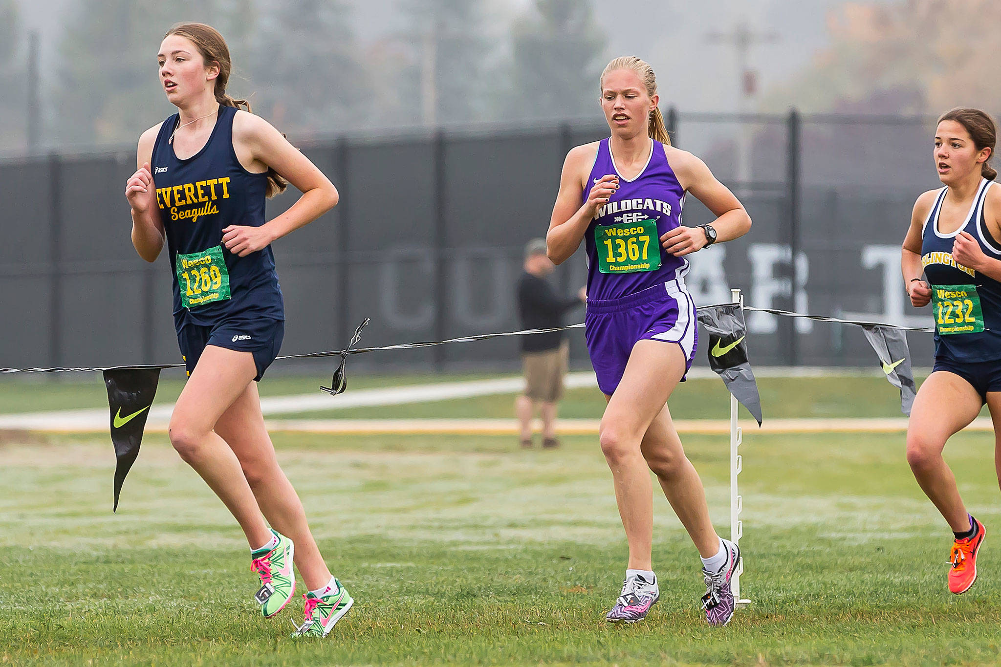 Oak Harbor’s Natalie French, center, competes in the Western Confernce Championships in Lakewood.(Photo by John Fisken)