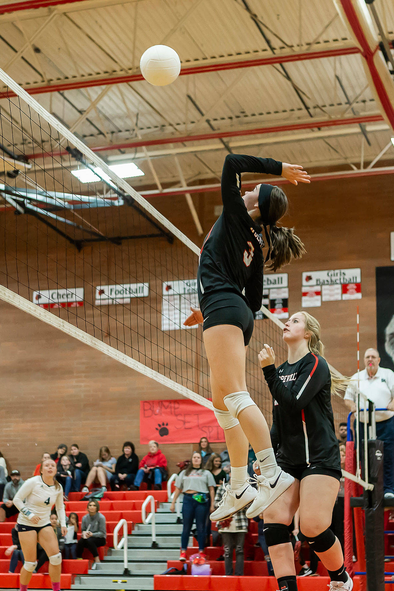 Maya Toomey-Stout rises for a kill against Sultan as Hannah Davidson watches the attack.(Photo by John Fisken)