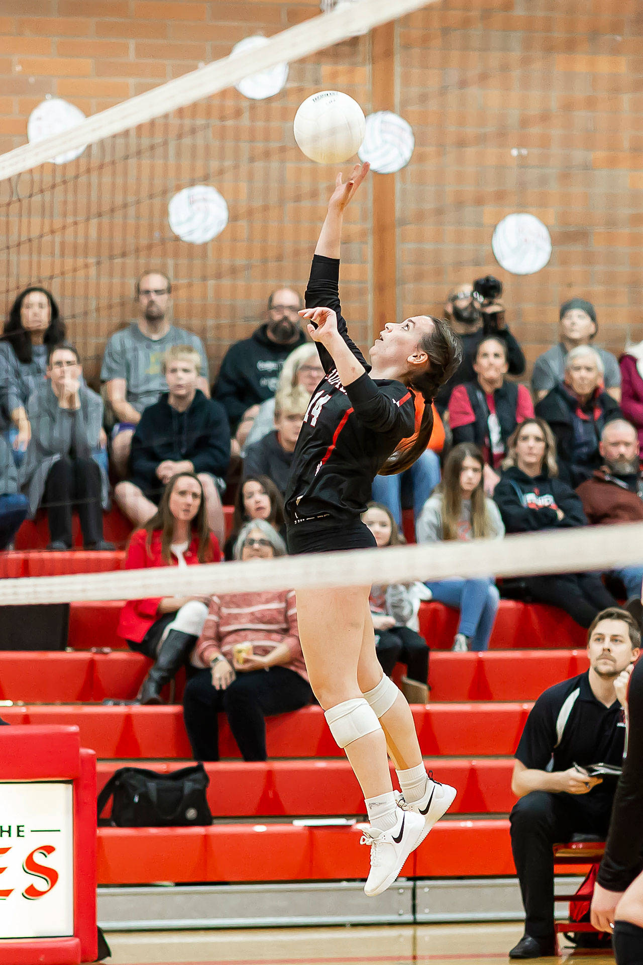 Ashley Menges tips in Tuesday’s match with King’s.(Photo by John Fisken)