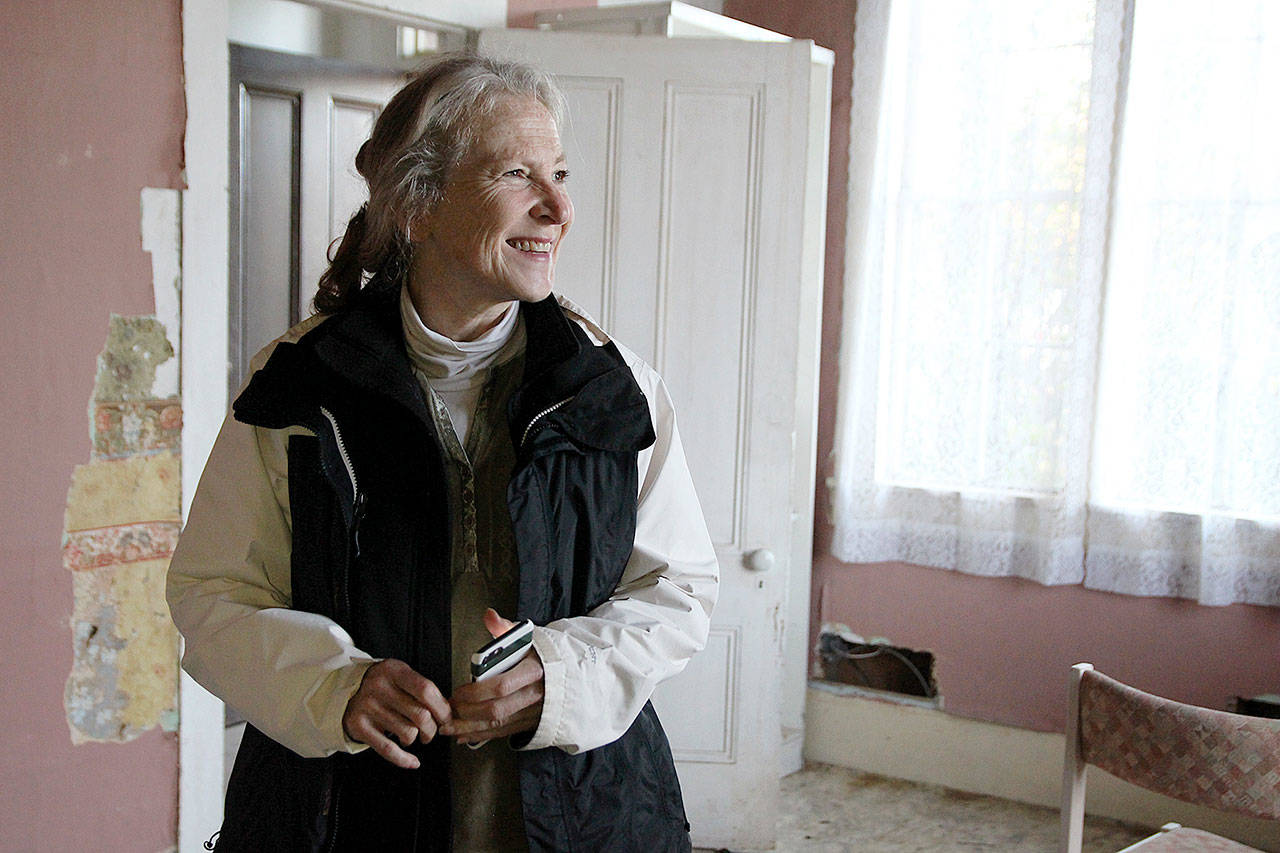 Photo by Laura Guido/Whidbey News-Times. Lynn Hyde stands inside the Haller House, a historic home that her nonprofit group recently purchased in order to preserve it.