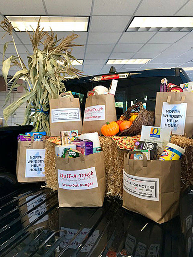 Photo provided.                                Oak Harbor Motors is hosting a “Stuff-A-Truck” fundraiser throughout November for North Whidbey Help House. The pickup will be driven to the food bank at the end of the month.