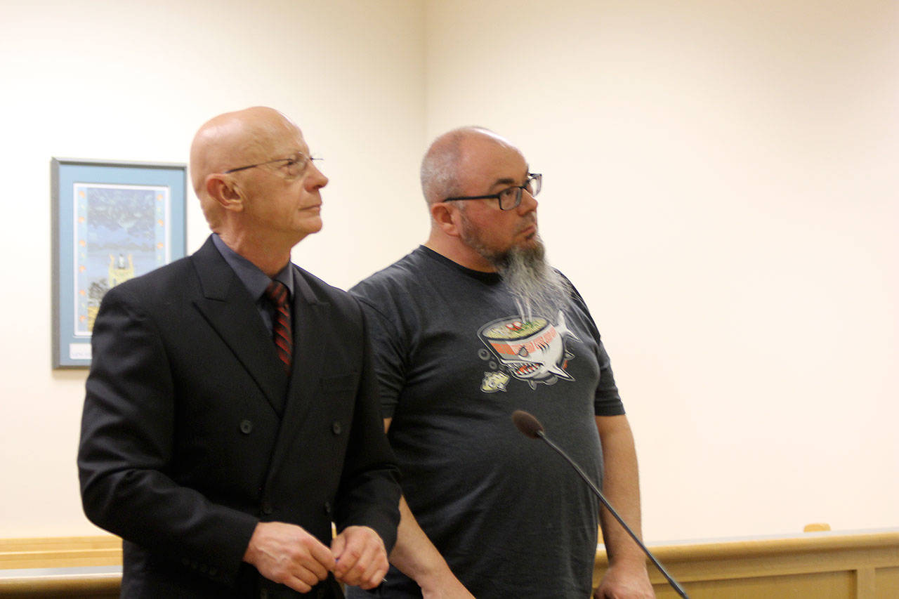Photo by Jessie Stensland / Whidbey News-Times.                                Lewis Cox appears in court Friday with attorney Steve McKay. Cox pleaded guilty to child porn charges.