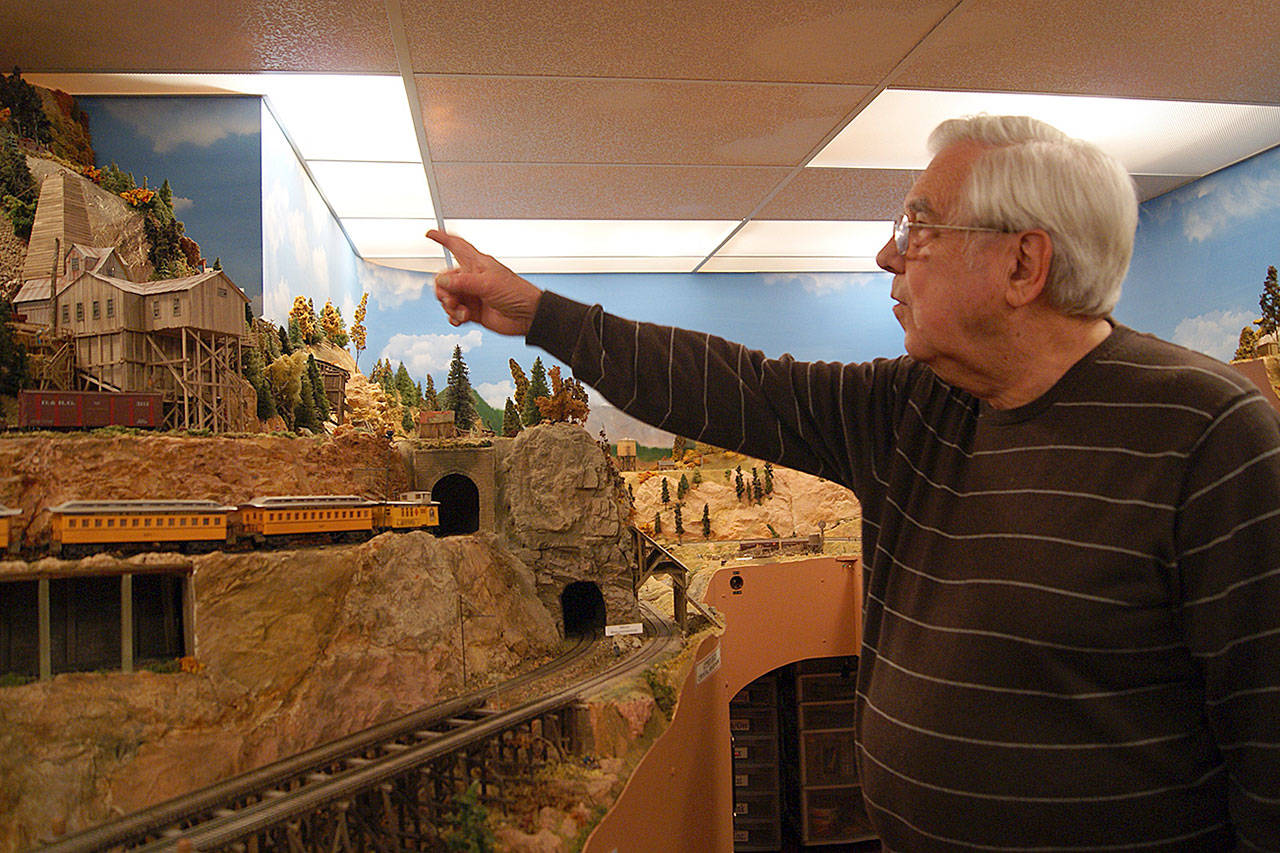 Photos by Maria Matson/ Whidbey News Group .                                Each holiday season, Jack Tingstad invites the public into his Coupeville home to see the model rairoad he created. Tingstad said this may be the last year for the public to view the display.