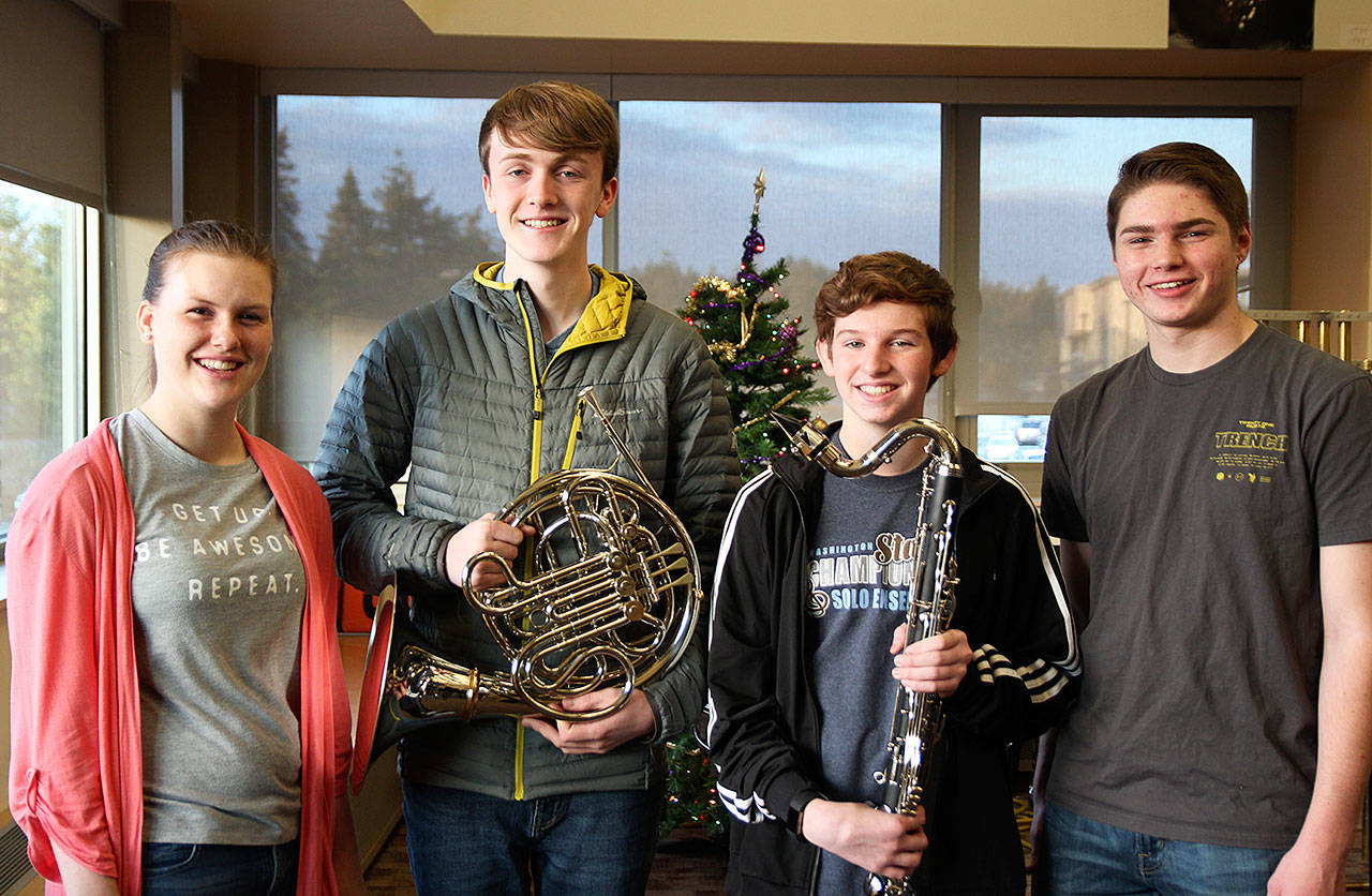 From left, Oak Harbor High School students Halle Lemme, Spencer Lien, Logan Gore and Carl Davis were recently selected to perform with Washington all-state and National Association for Music Education All-Northwest ensembles. Photo by Laura Guido/Whidbey News-Times