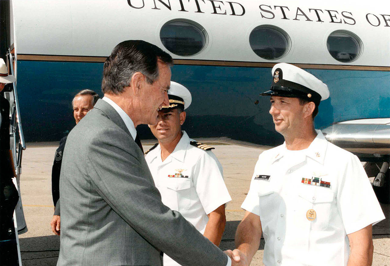 Photo provided.                                North Whidbey resident Charlie Moore was command master chief at Naval Air Station Joint Reserve Base Willow Grove in 1992 when he met and shook hands with President George H.W. Bush.